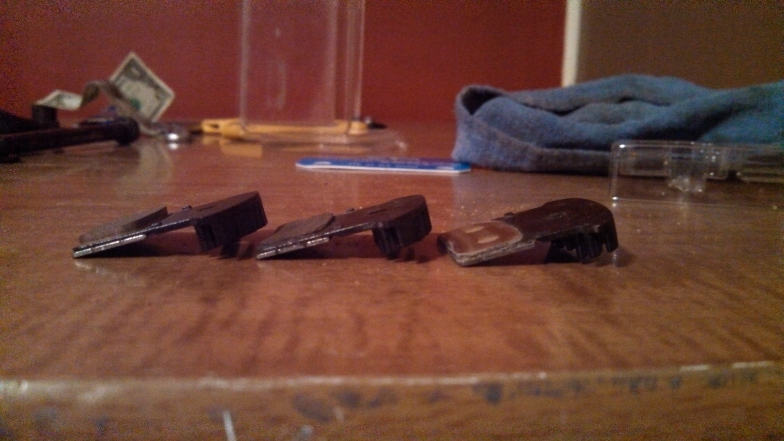 Brake pad wear, from left to right: Brand new, Worn (should be replaced), and Nothing Left.