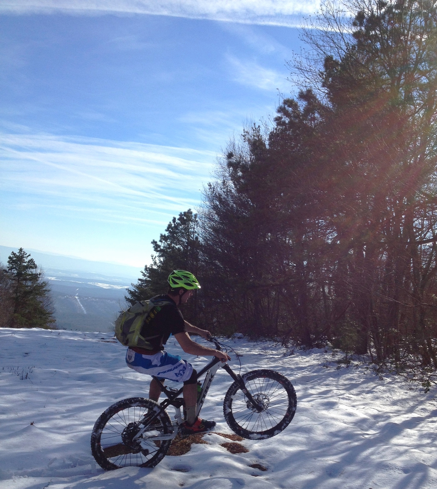Collin rode a wheelie the entire ridge never touching his front tire to the white slush.
