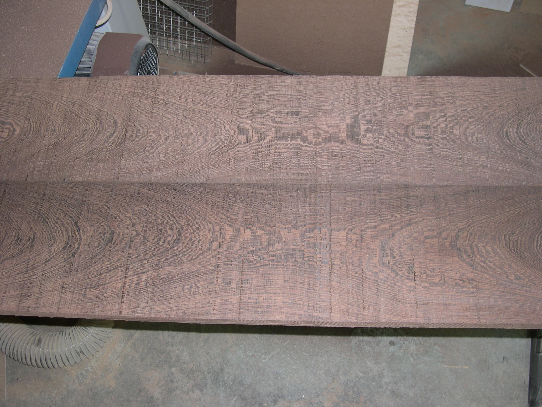 African wedge mantle on stone fireplace - Grain close-up