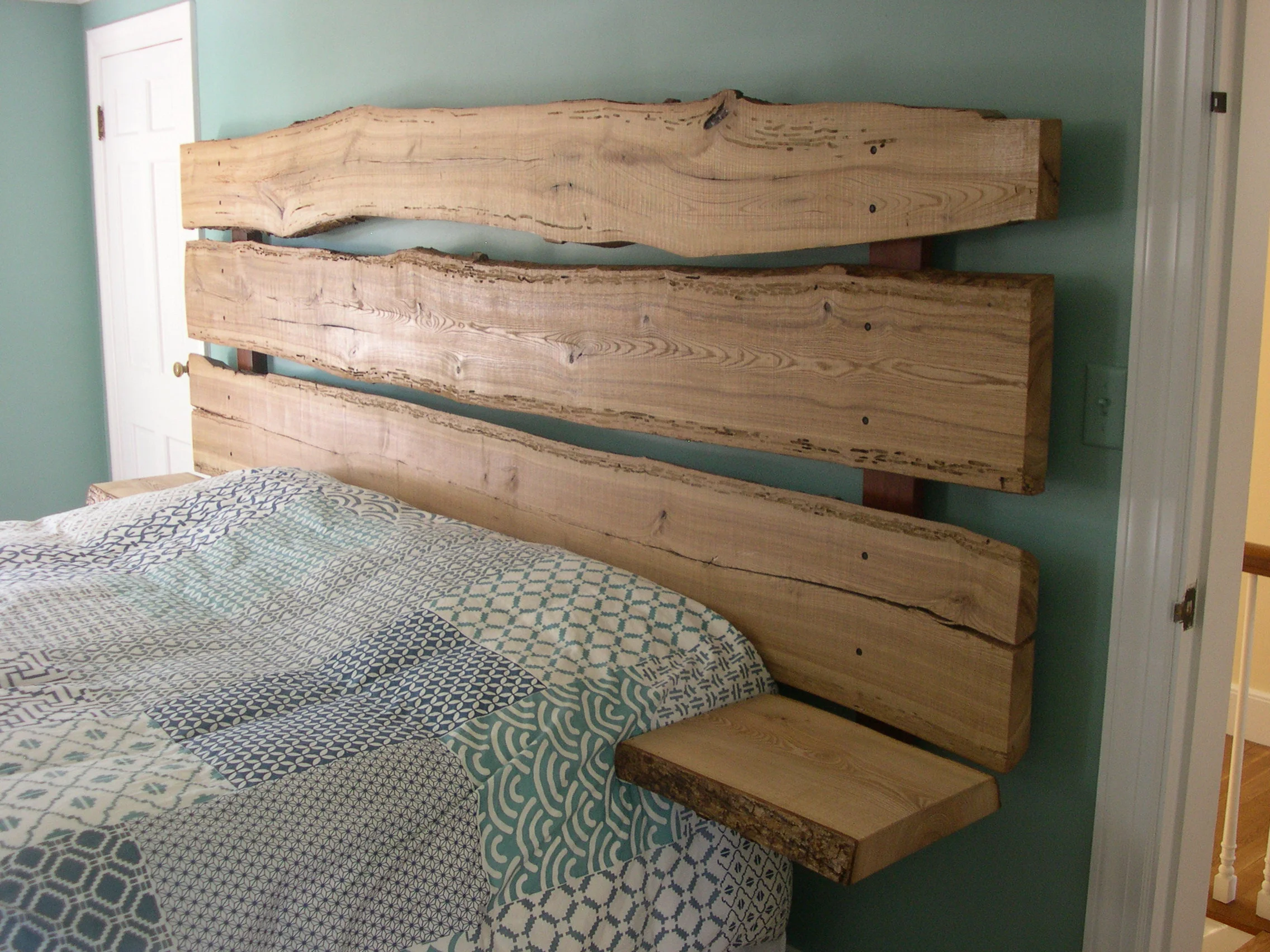 Headboard and nightstands of reclaimed ash