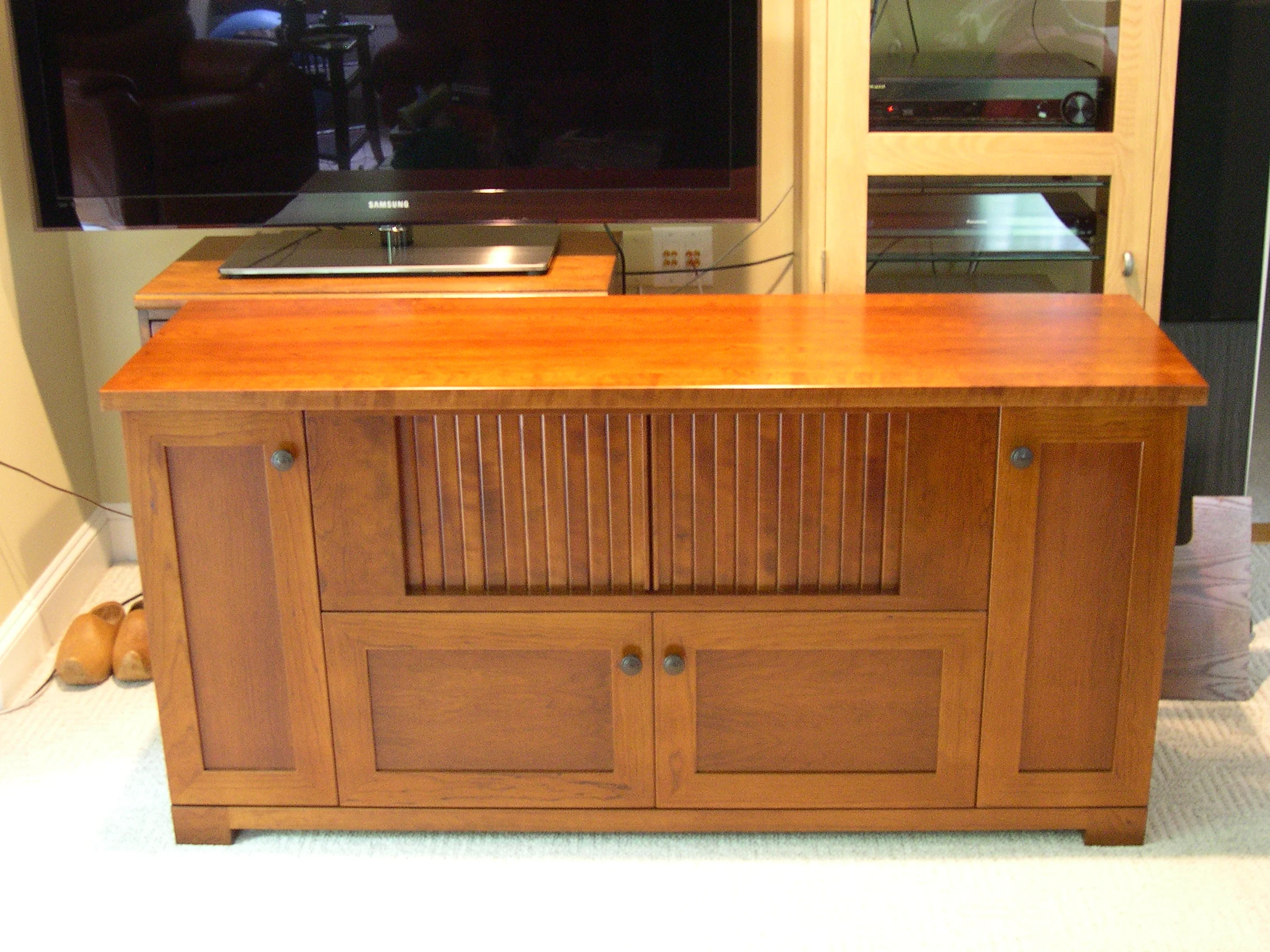 Cherry television cabinet with speaker compartments