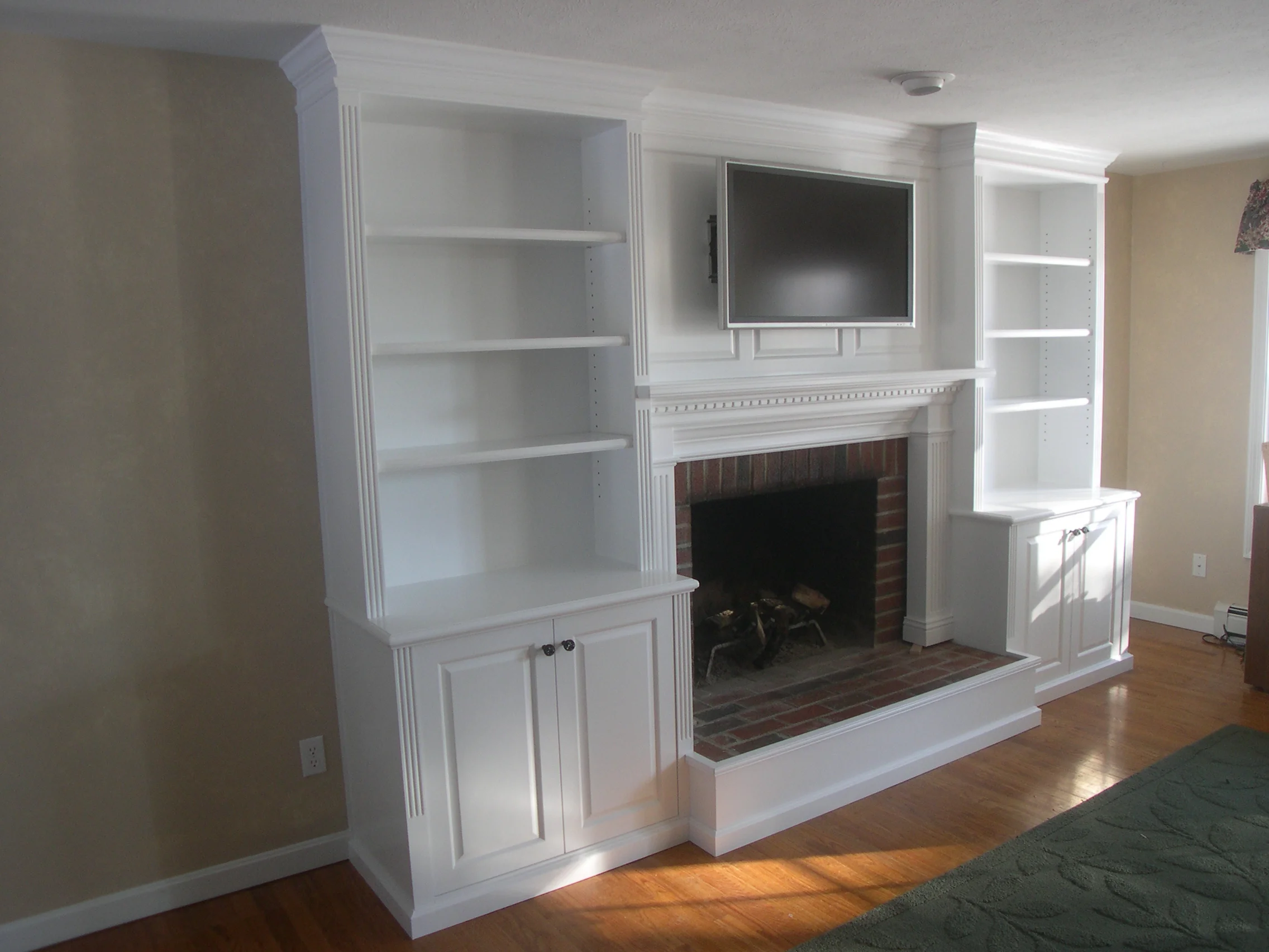 Fireplace surround wall unit