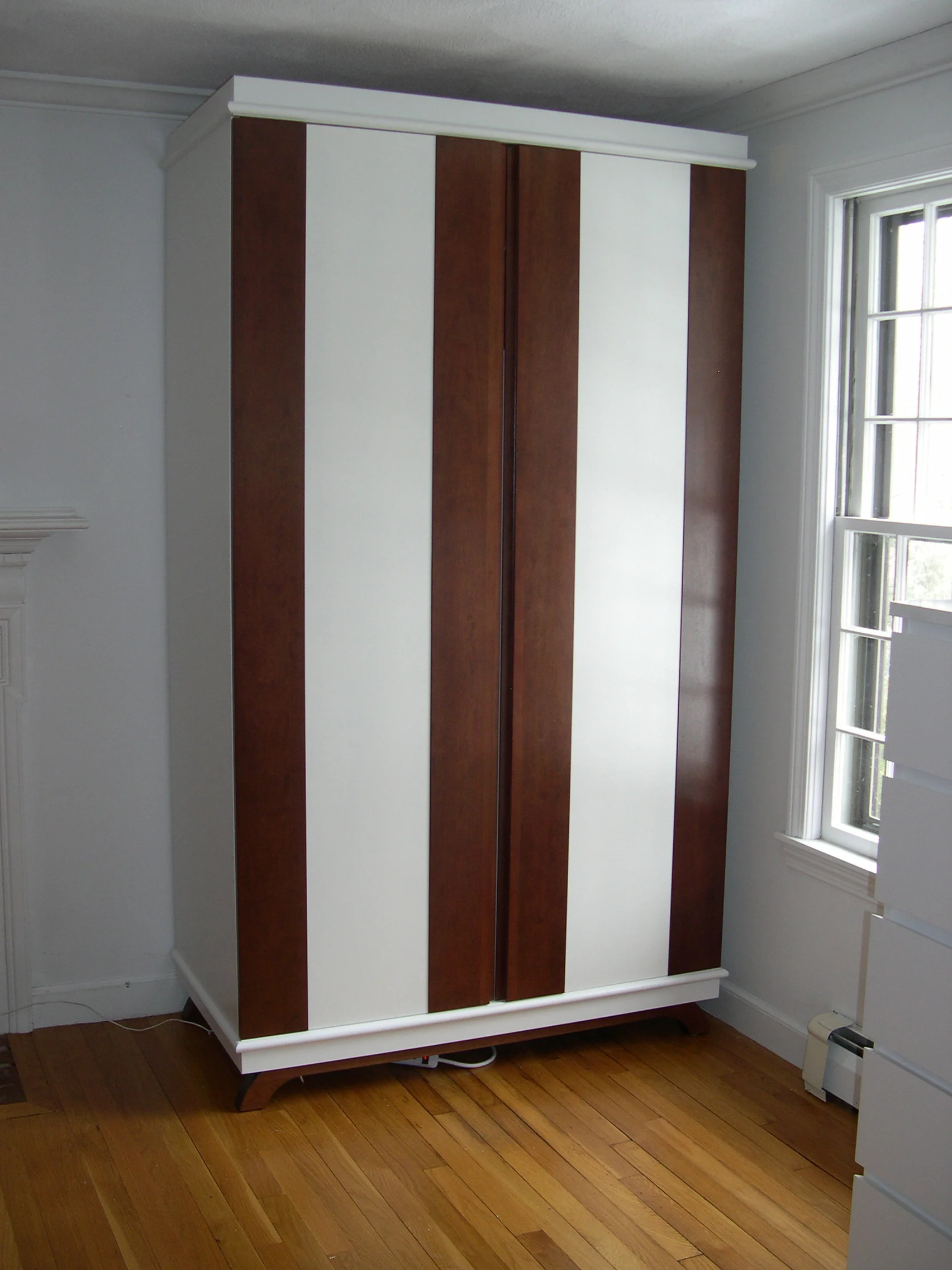 Contemporary wardrobe with cherry-bordered doors