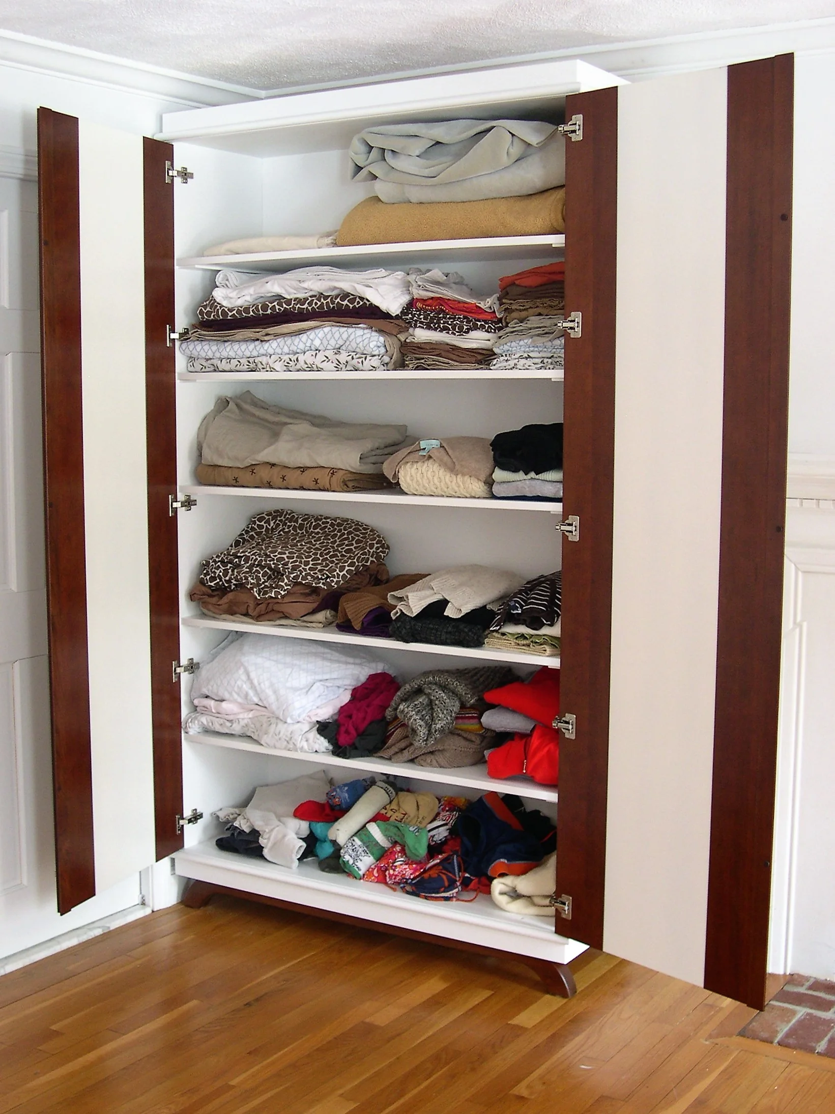  Open contemporary wardrobe with cherry-bordered doors