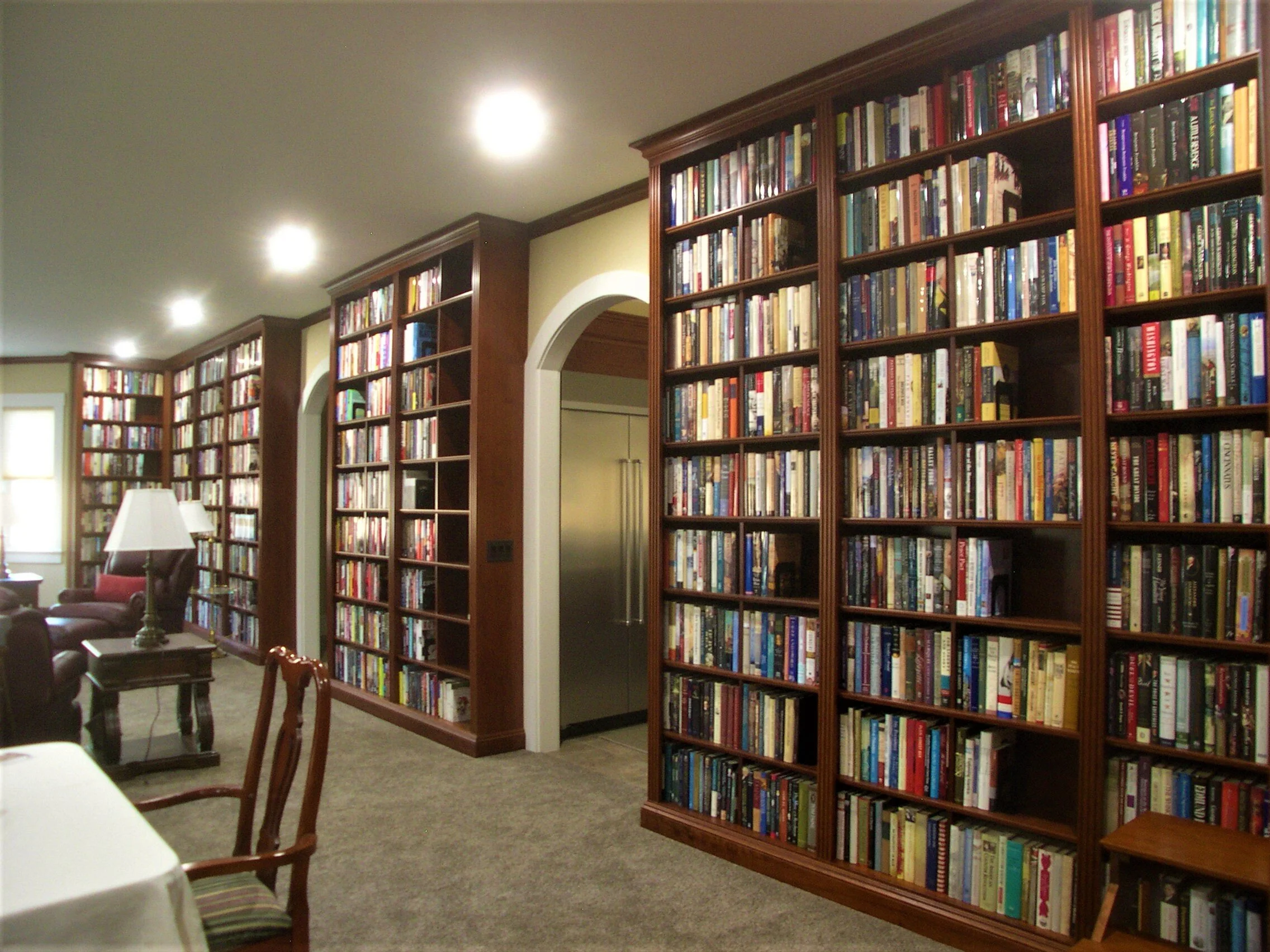   Living room library bookcases, stained cherry with clear lacquer finish - side wall  