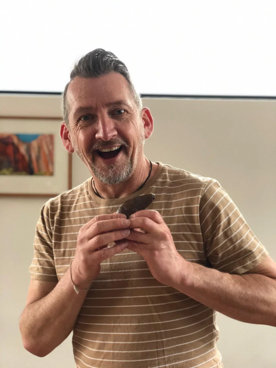 Connah holding the tooth of a five million year old physeteroid.