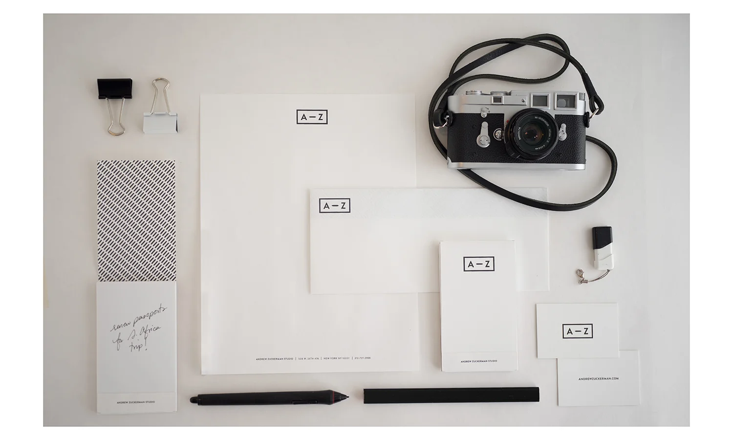 Styled stationary set; letterhead and envelope, notepad, business card. Photography by scotttsai.com