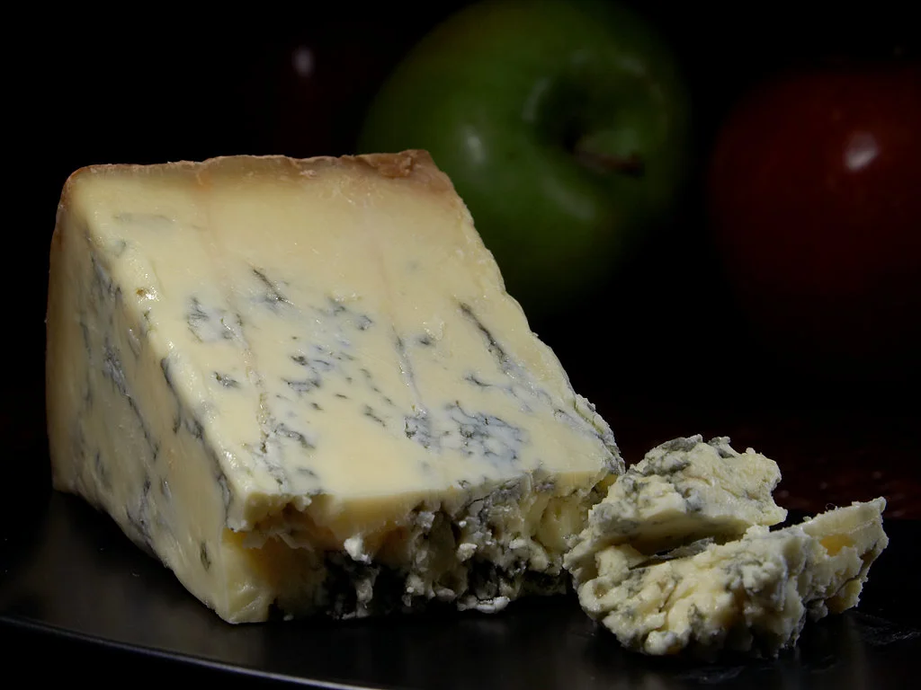 "Blue Stilton cheese" by Jon Sullivan (Public Domain via Wikimedia Commons)