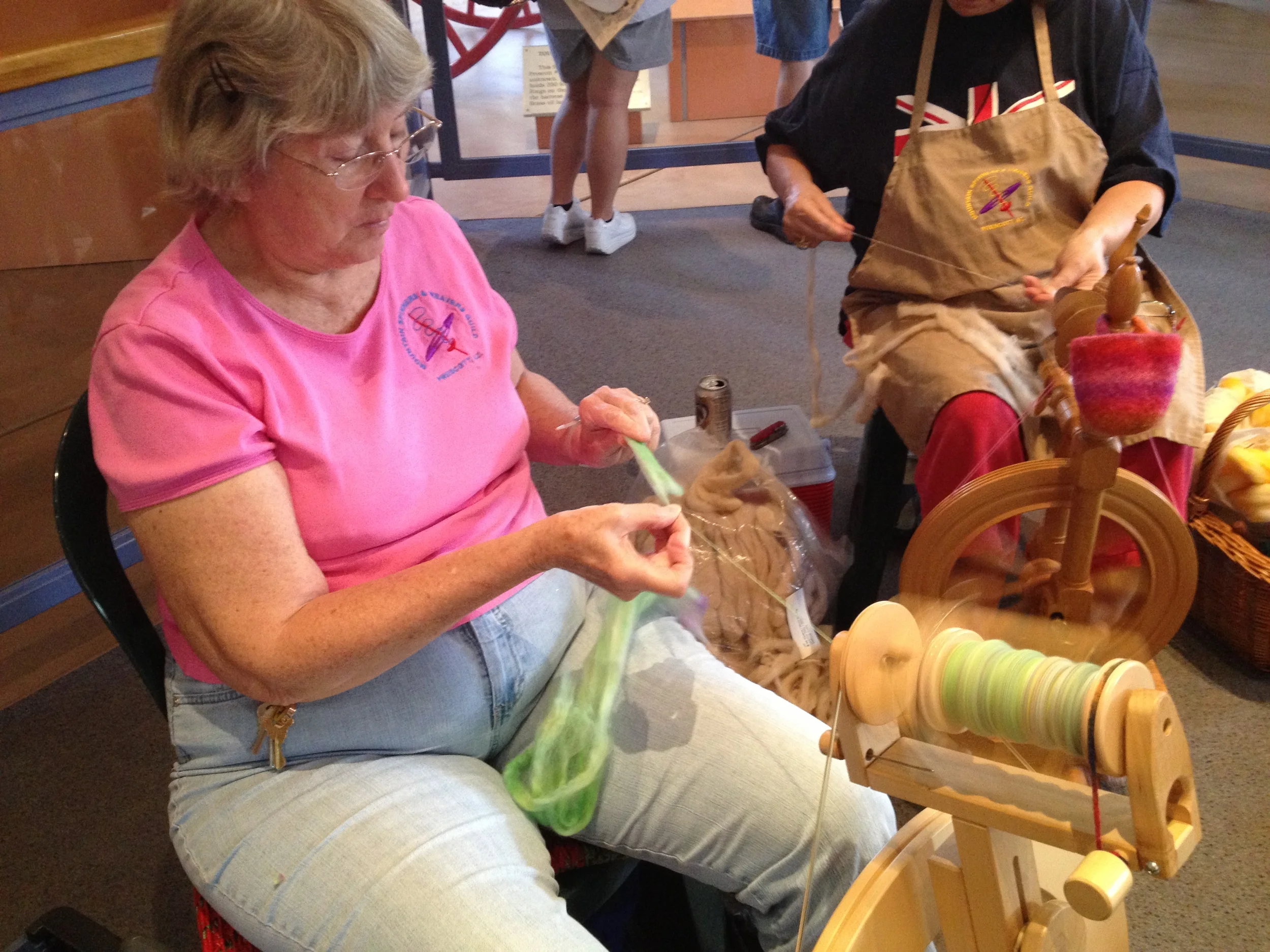 Feeding the roving onto the spindle. (If I recall, this was some that had been koolaid-dyed, but don't quote me on that.)