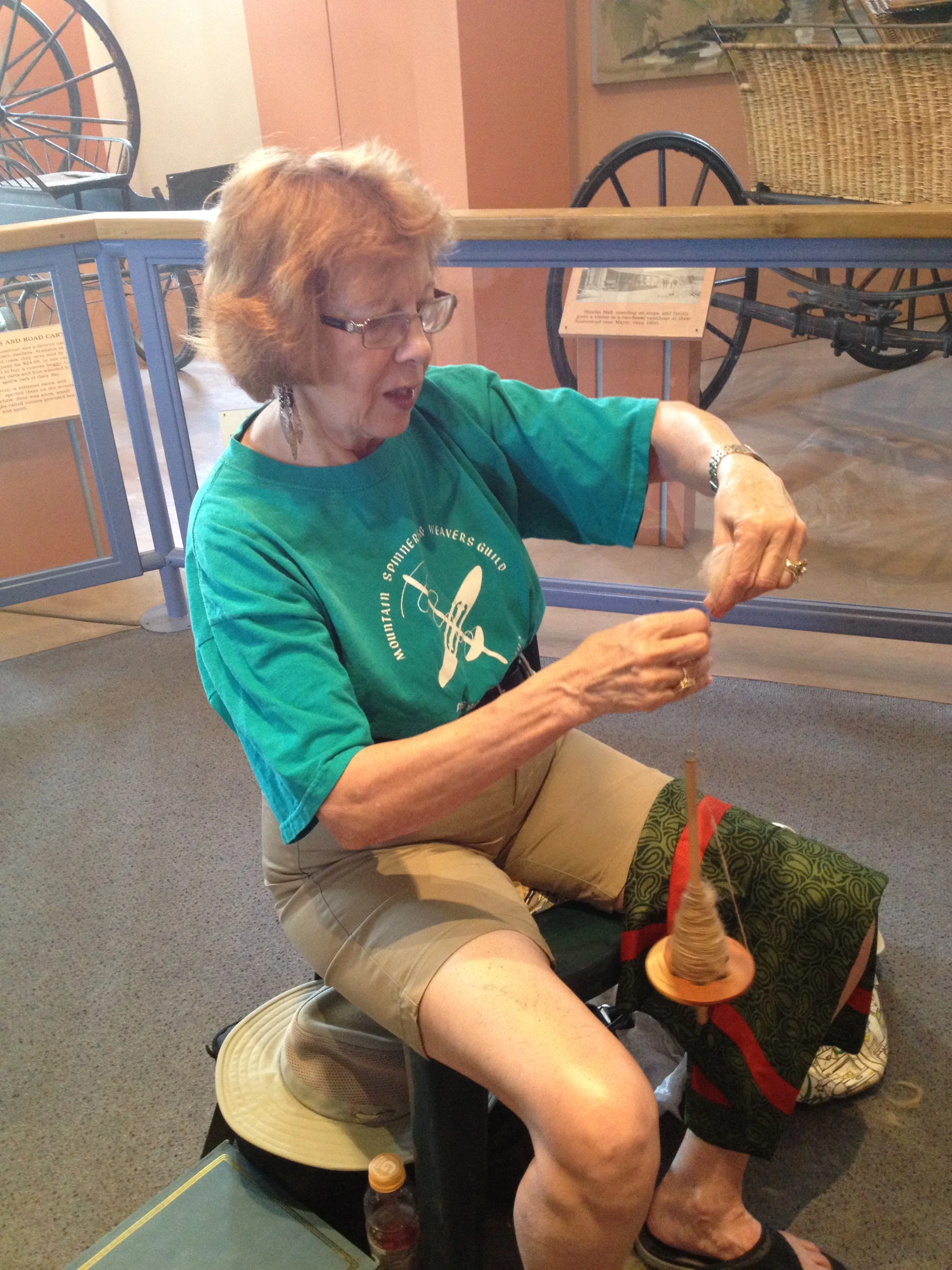 A hand-spindle. I'd think this would take some wrist strength, but nicely portable. Good for business travel.... Hmmm....
