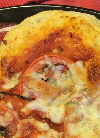Fri PM pizza--using Reinhart's sauce recipe with my own dough recipe (for speed). Standard toppings: tomato sauce, sliced Roma tomatoes, fresh basil from my garden, shredded mozzarella.
