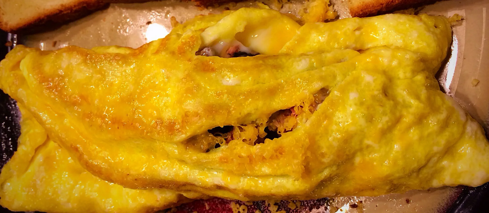 Steak and shredded cheddar omelette, with the steak diced very, very small as I was testing whether I could handle chewables yet.