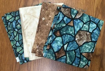 Or maybe you'll get this set of Stonehenge fat quarters, looking a bit like stained-glass windows.