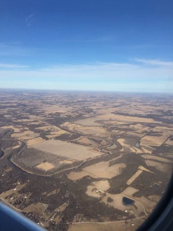 From my plane window, somewhere over Missouri, heading home. It was nearly 60 there--arrived home to under 30 degrees and snow.