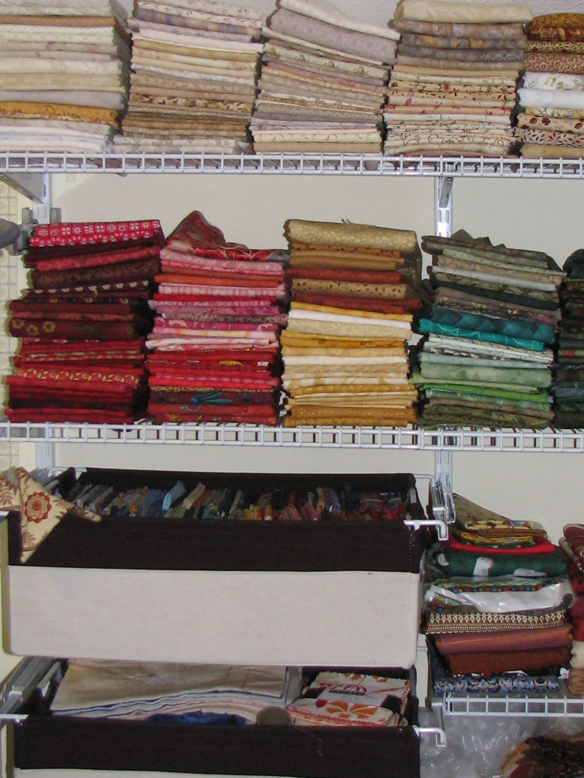 My stash when I first set up this shelving system. It doesn't look all that different now 10 years later. In fact, I even still have a lot of those same fabrics!