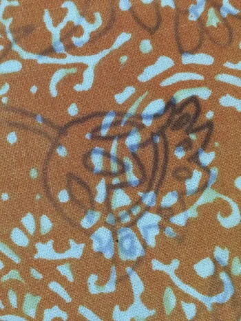 Caution: the iron-on transfer ink did bleed through my embroidery background fabric onto my ironing board. Oops--didn't see that warning in the instructions until too late. Apparently I was supposed to have protective layer underneath. Unfortunately, the instructions offer no guidance as to whether this can be fixed!