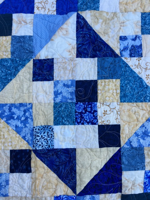 Block detail--to show you the quilting design, not my piecing--although this block's not too bad, considering. 