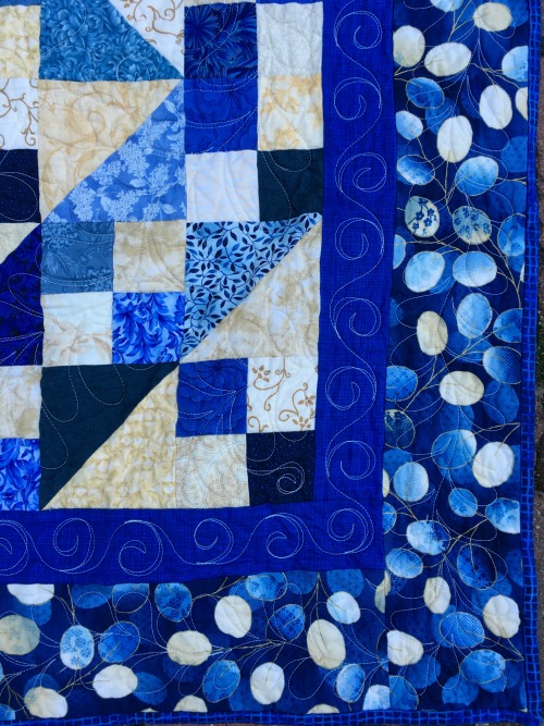 Corner--you can see the inner and outer border quilting designs here.