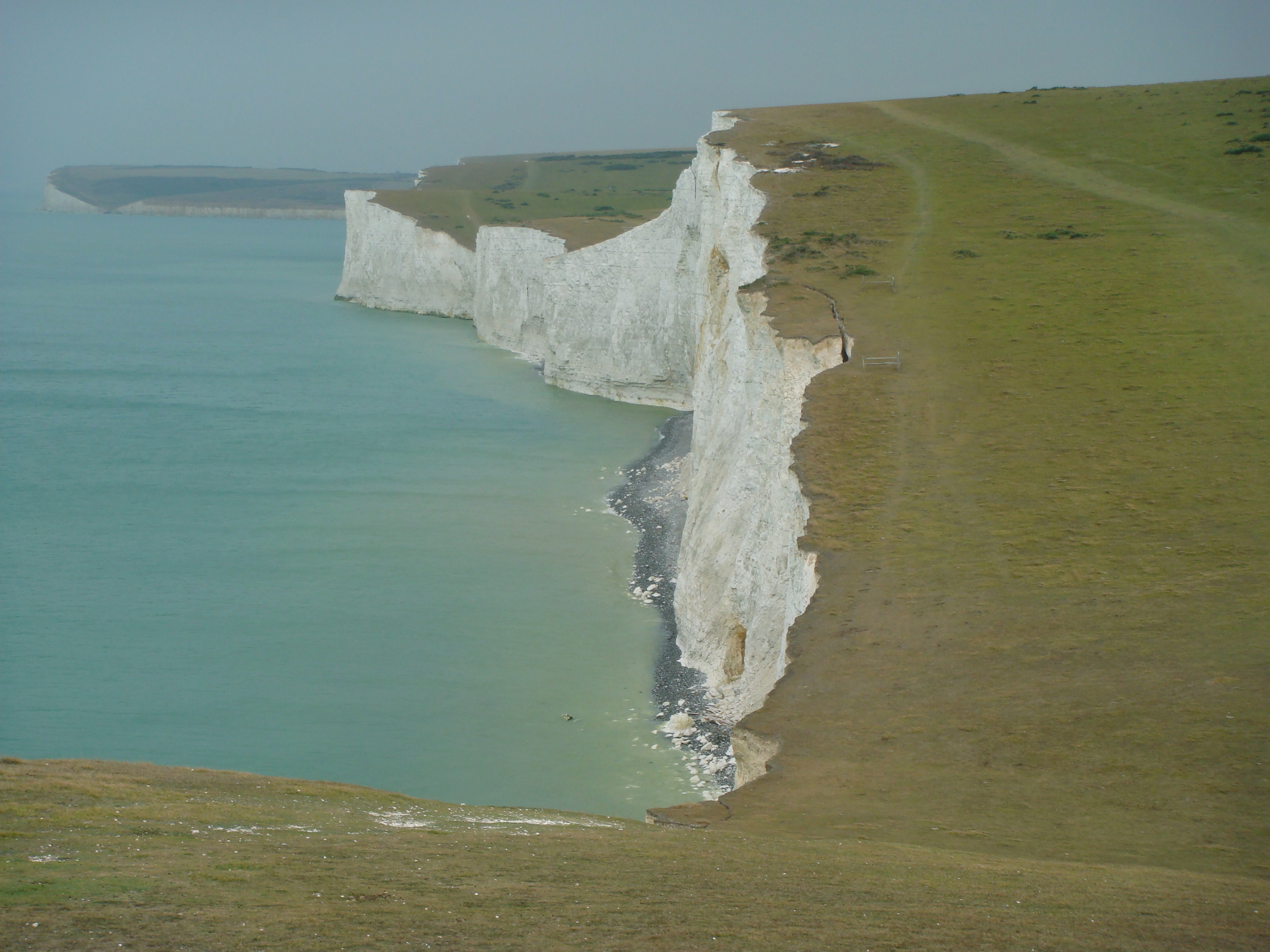 The eastern section of the South Downs Way parallels the white chalk cliffs of the English Channel.