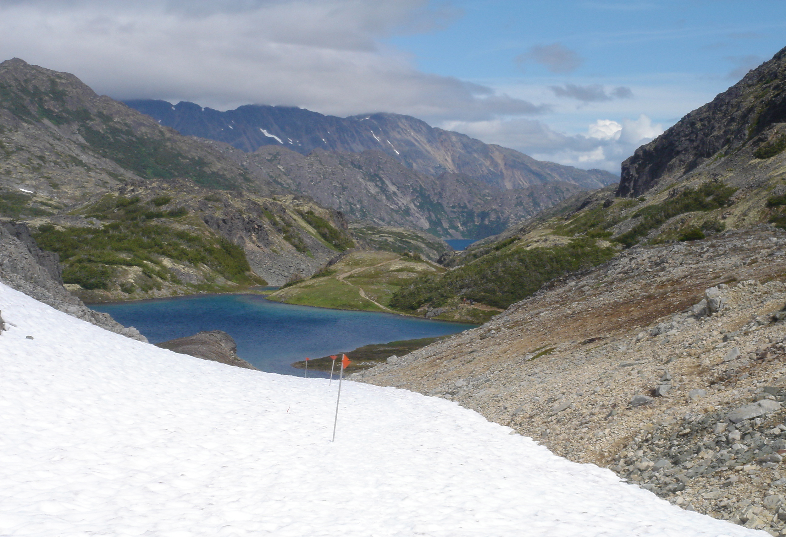 Flags mark the Chilkoot Trail over the snowfields at higher elevations.