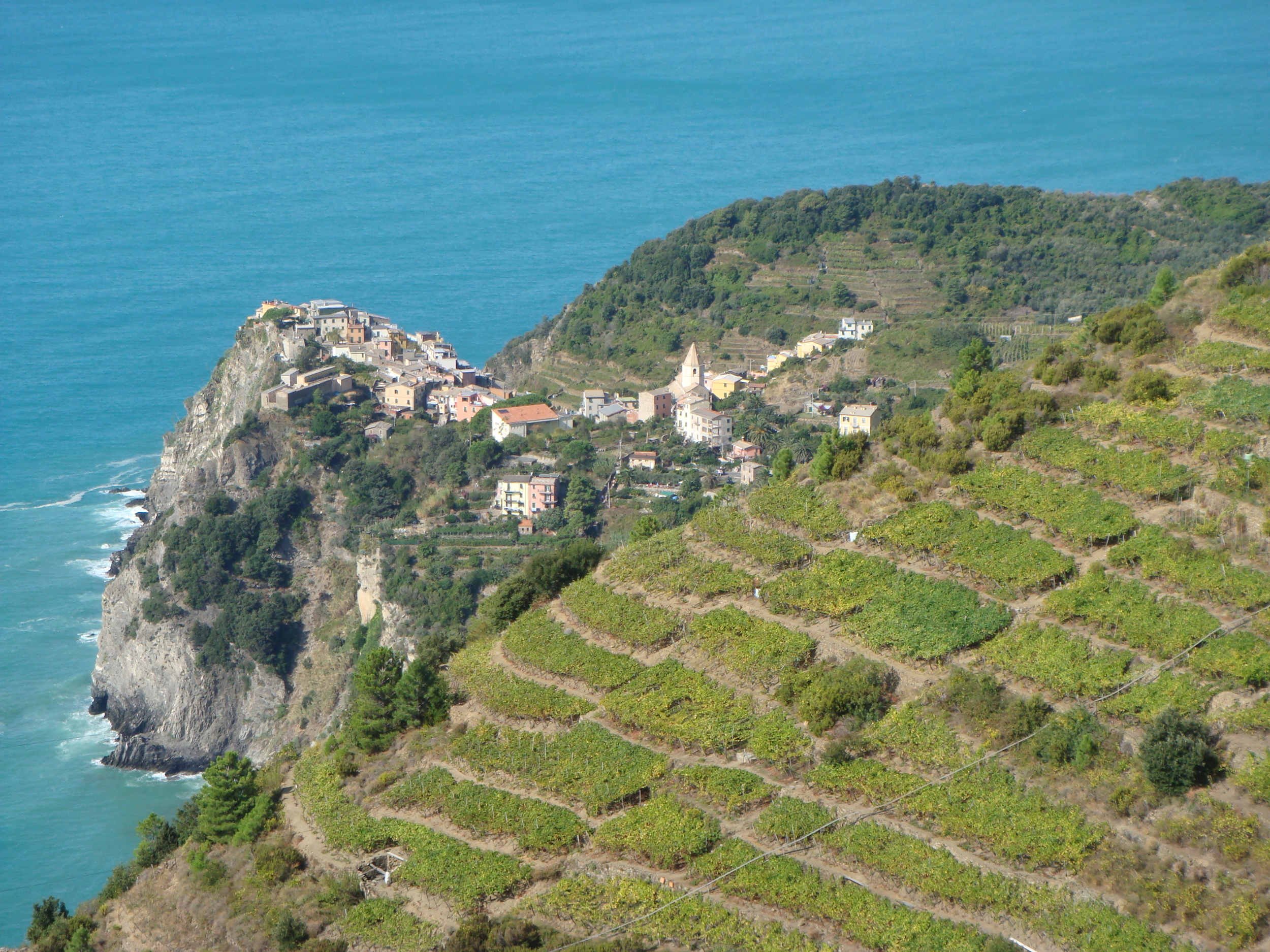 Walkers above Corniglia enjoy spectacular views of both land and sea.