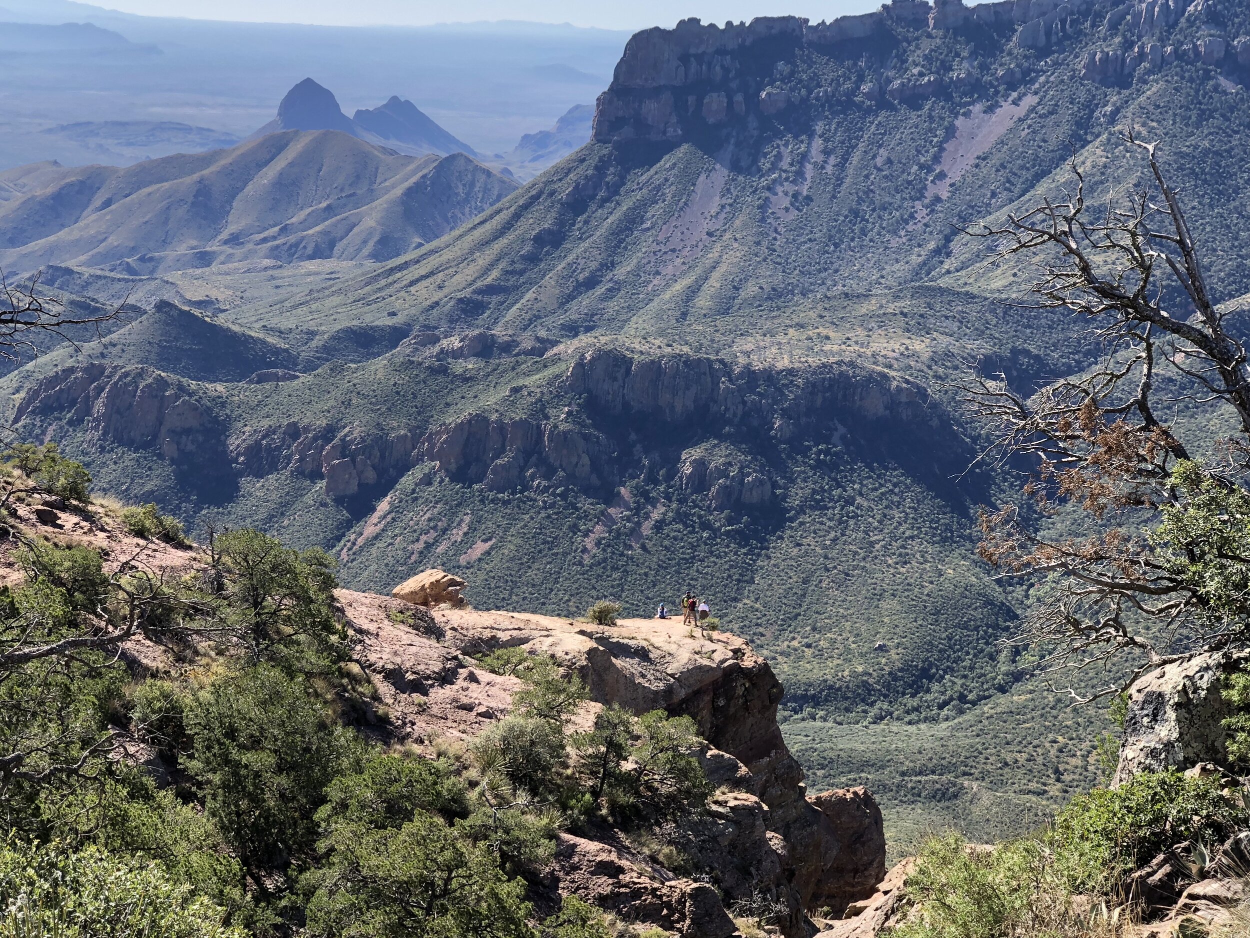 Hikers look south through the Chisos Mountains and on to Mexico.
