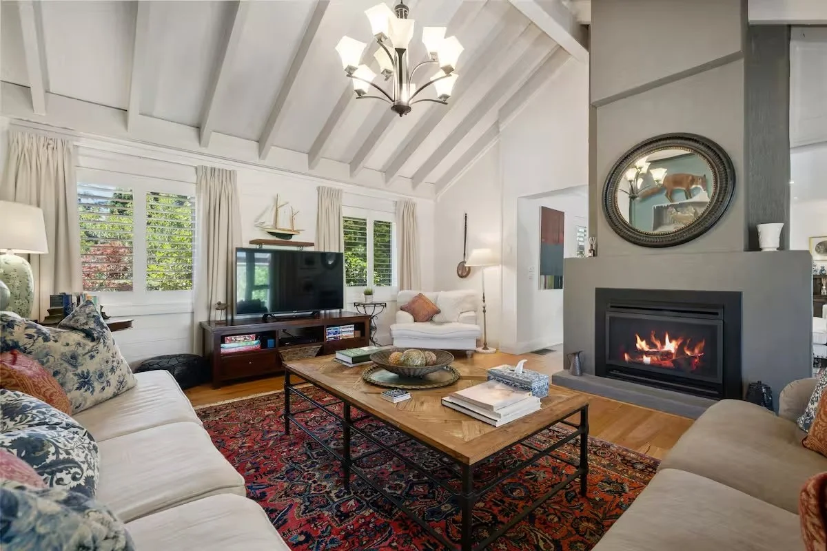 Second lounge room with a gas fireplace and chandelier