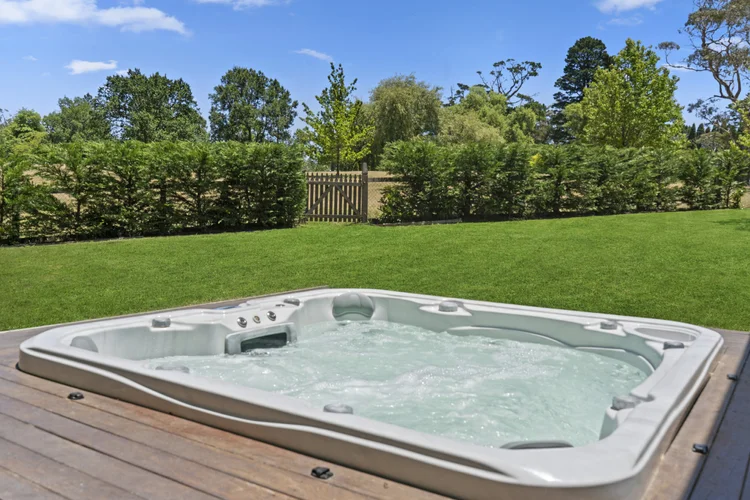 Outdoor spa on the deck, looking across the lawn