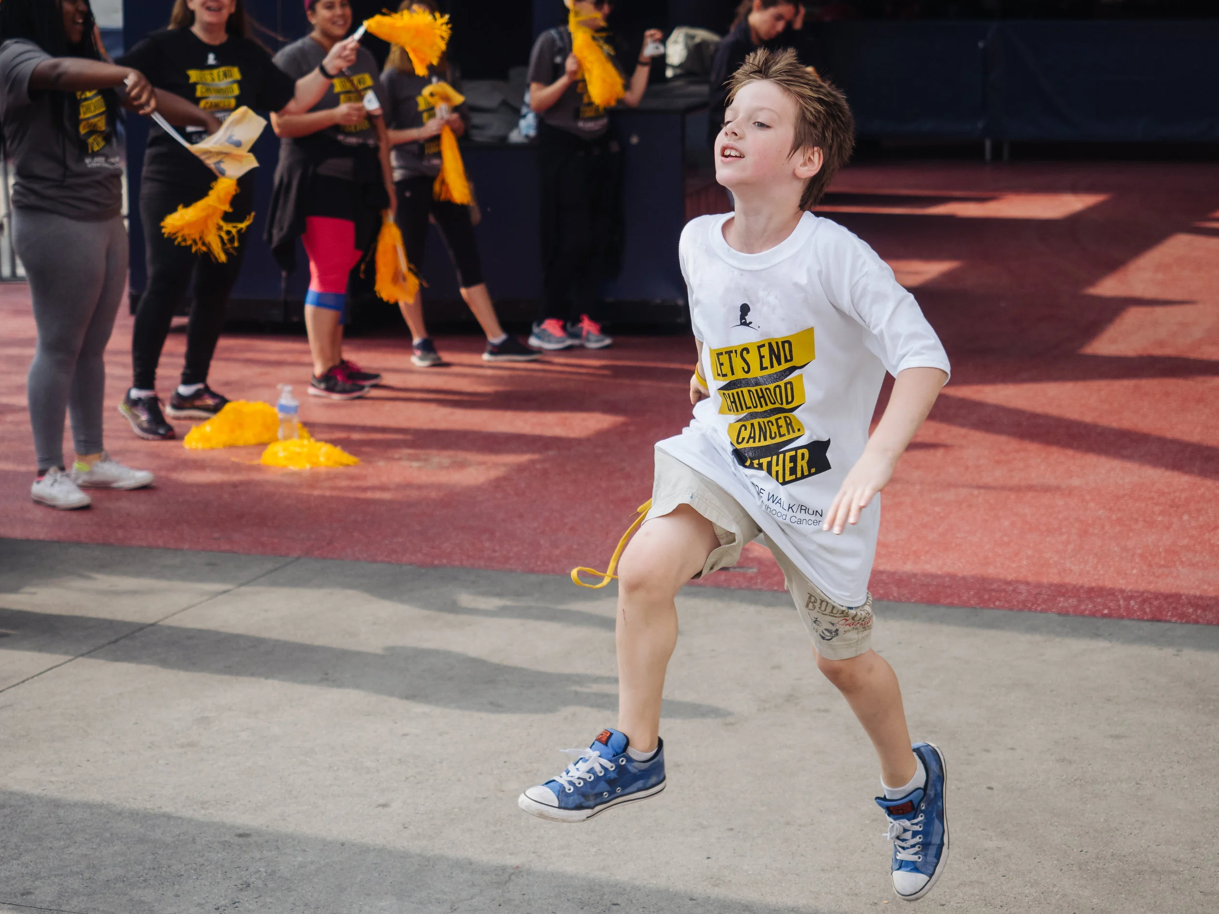 Boy Crosses the Finish Line in the St. Jude Walk/Run to End Childhood Cancer