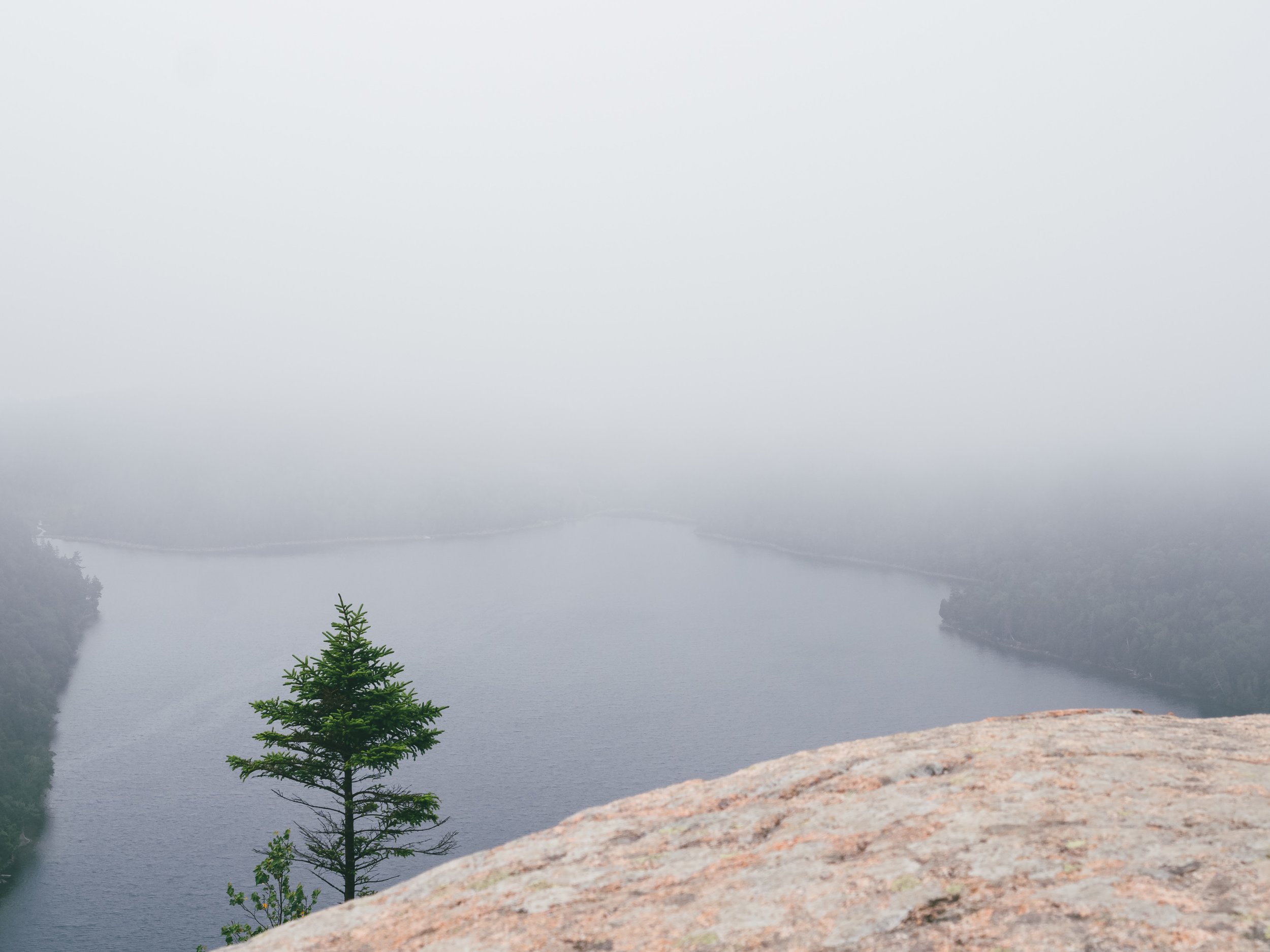 A foggy view from South Bubble down to Jordan Pond.
