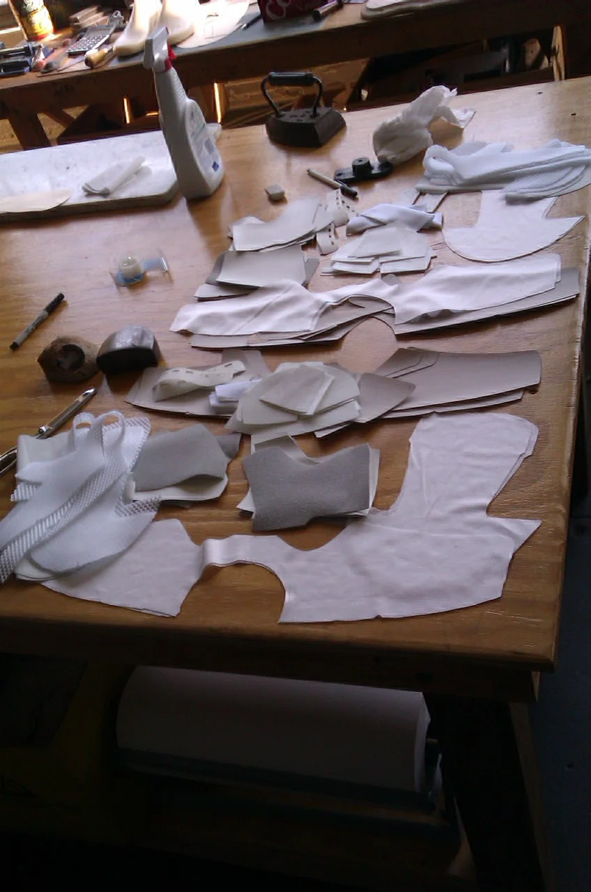 Most materials were hand cut, with the exception of the lace stays that were laser cut to achieve maximum precision and provide efficiency in the production line.