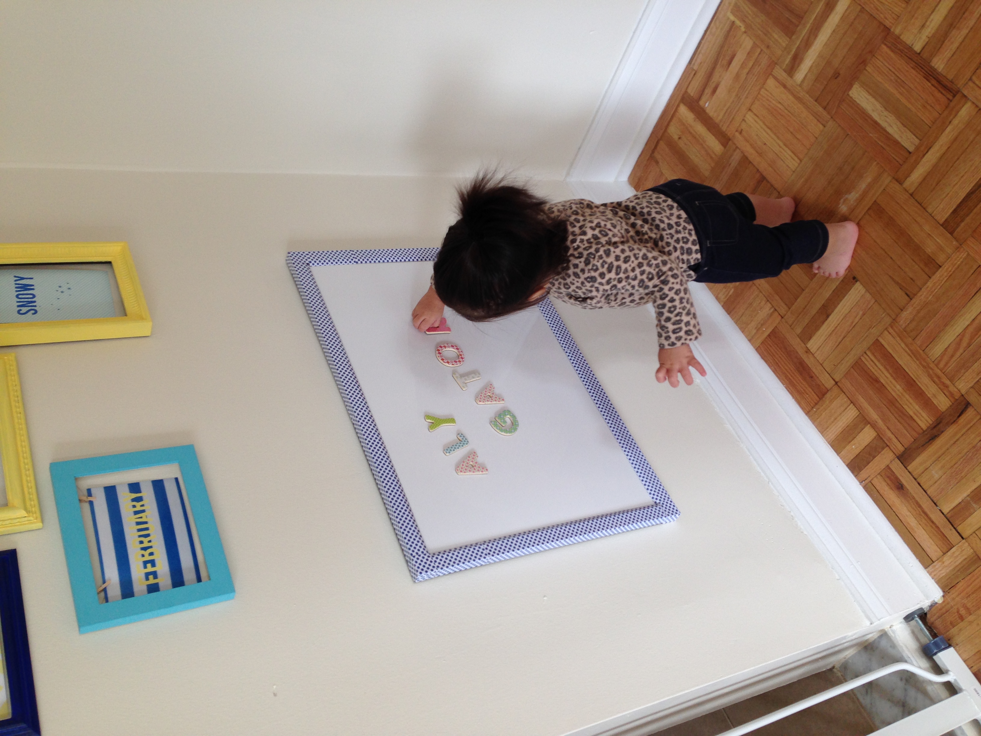 This dry erase/magnet board has been a huge hit! I showed Alynne how to use magnets once and she was hooked! She plays with them every day!