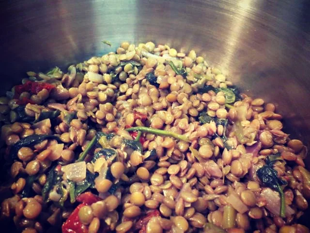  Heating leftover lentils on the stove top for lunch