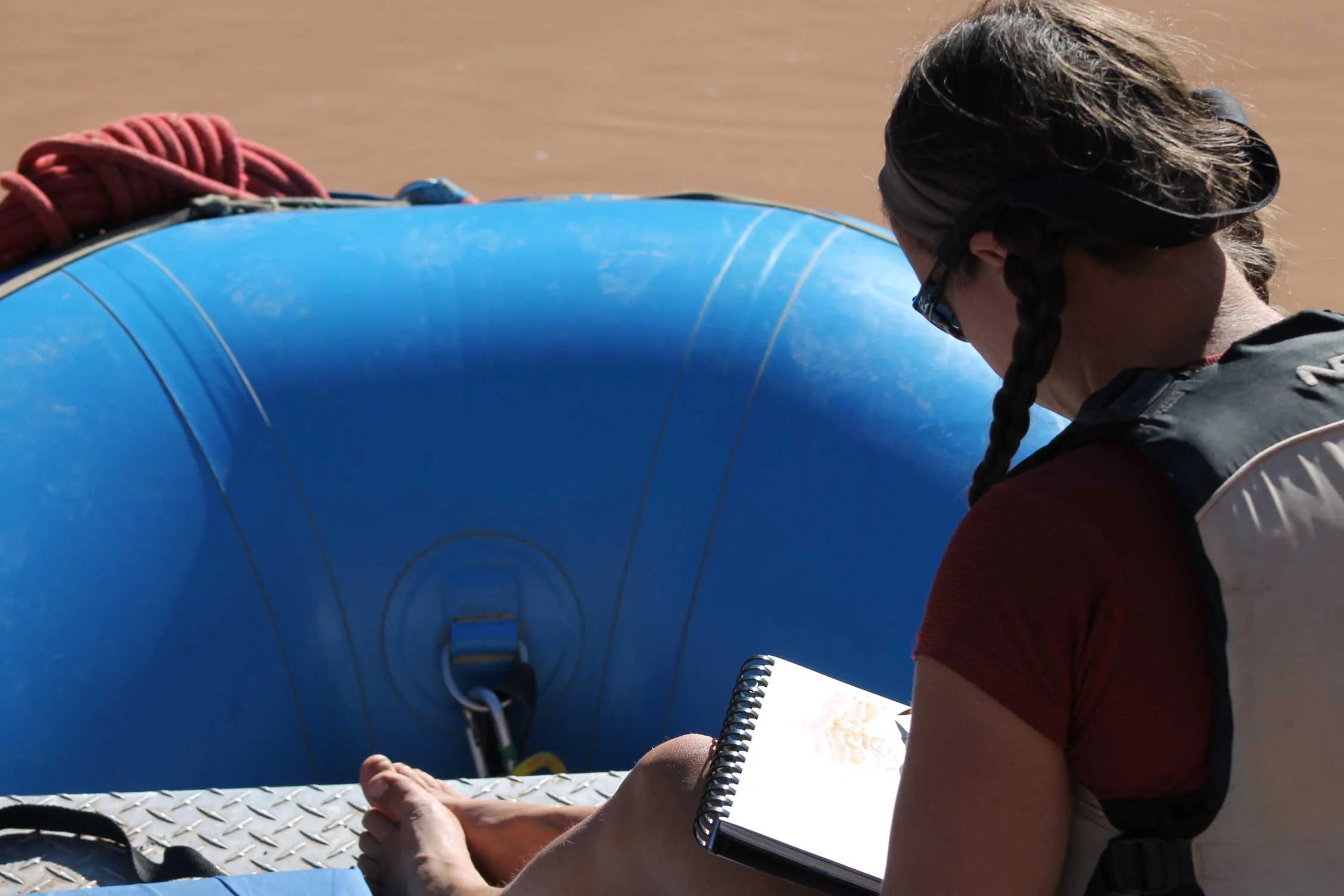 Sketching on the bow of the boat. Photo by Vince Hempsall