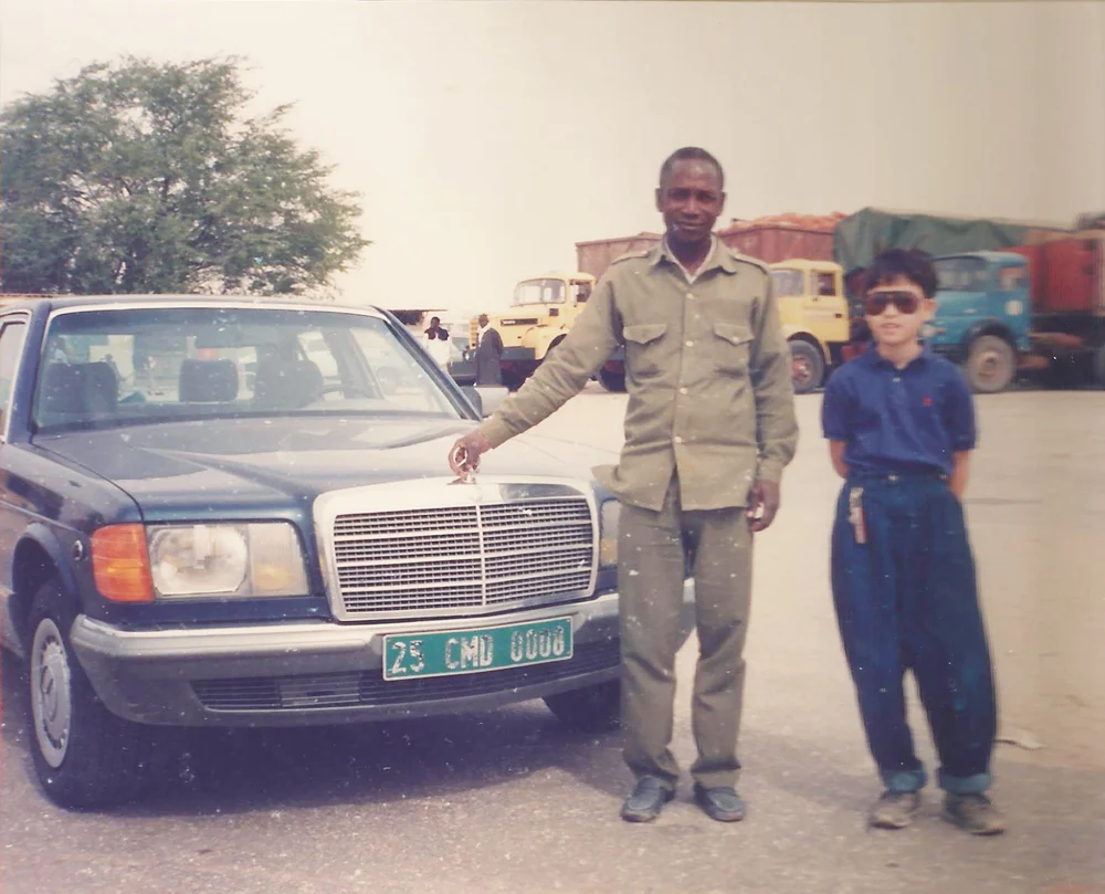 Mauritania, in northwest Africa. I am on the right. During the plague every inch of that car would be covered in locusts basking in the heat. Also, I bring 'hammer pants' to Africa.