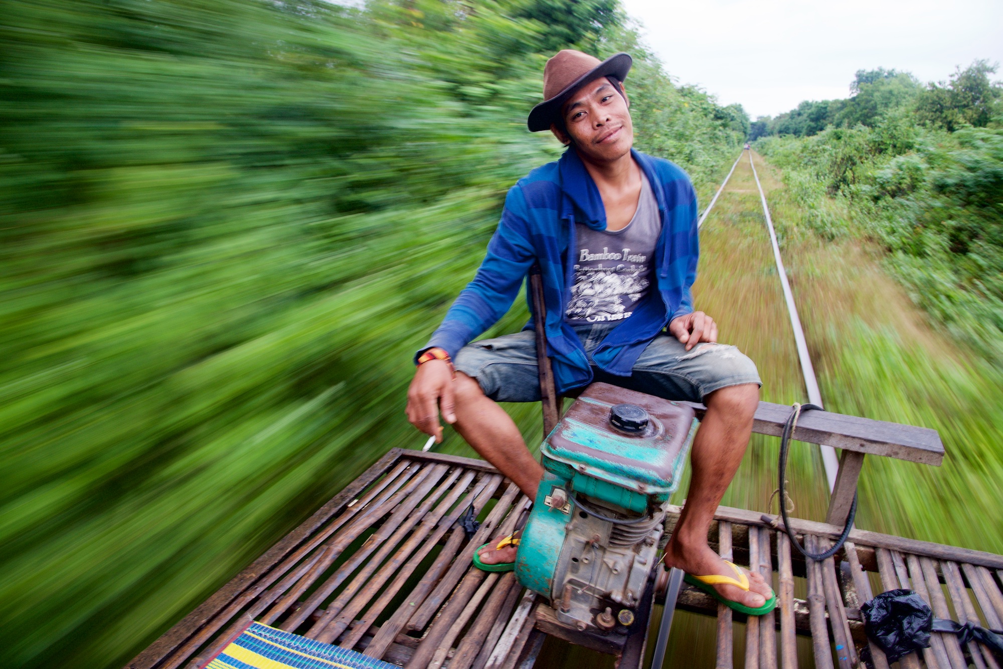 Bamboo Train Pilot in Motion - Battambang, Cambodia - Copyright 2014 Ralph Velasco.jpg