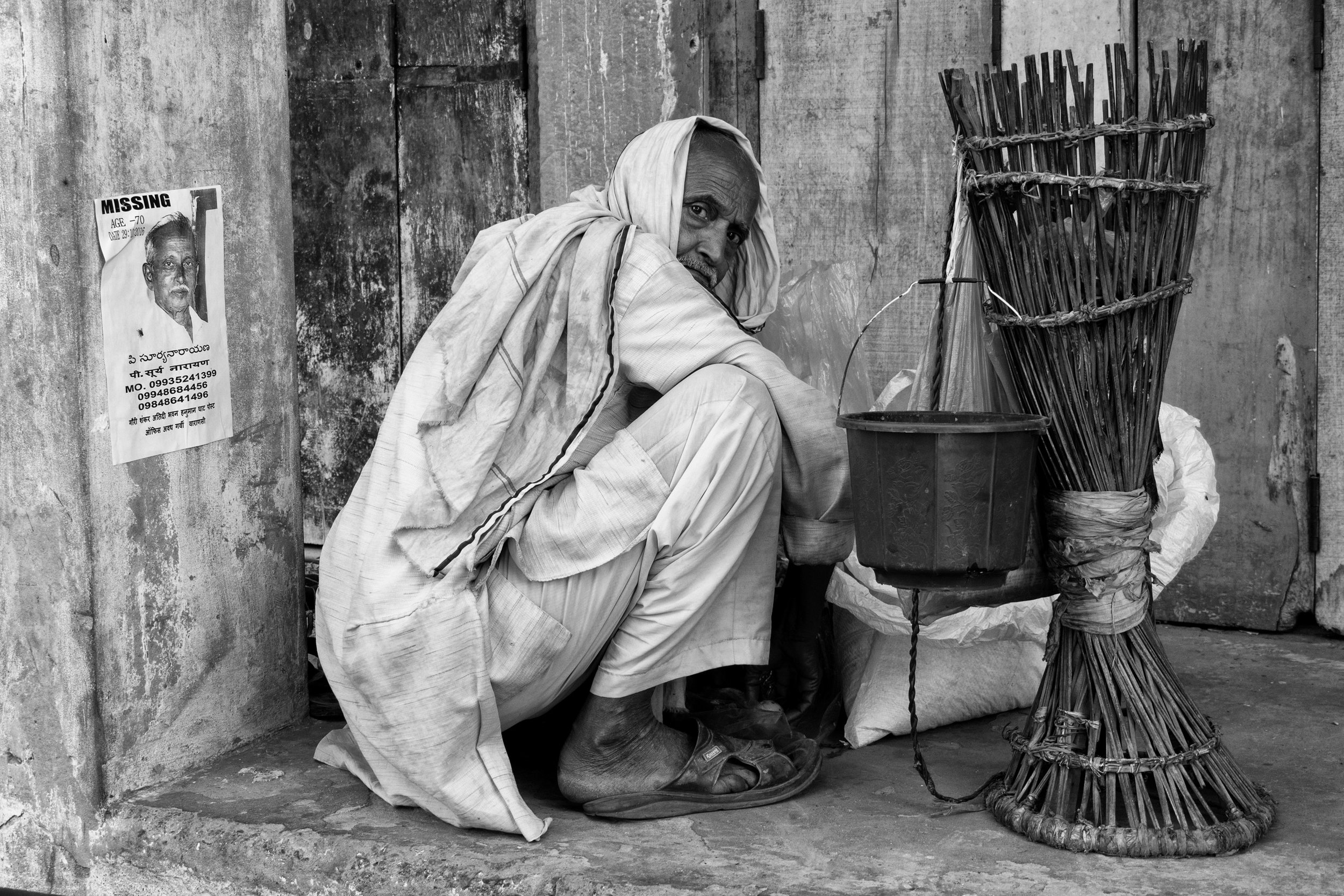 Man Crouched Down on Streets on Varanasi in Black and White - Varanasi, India - Copyright 2016 Ralph Velasco.jpg