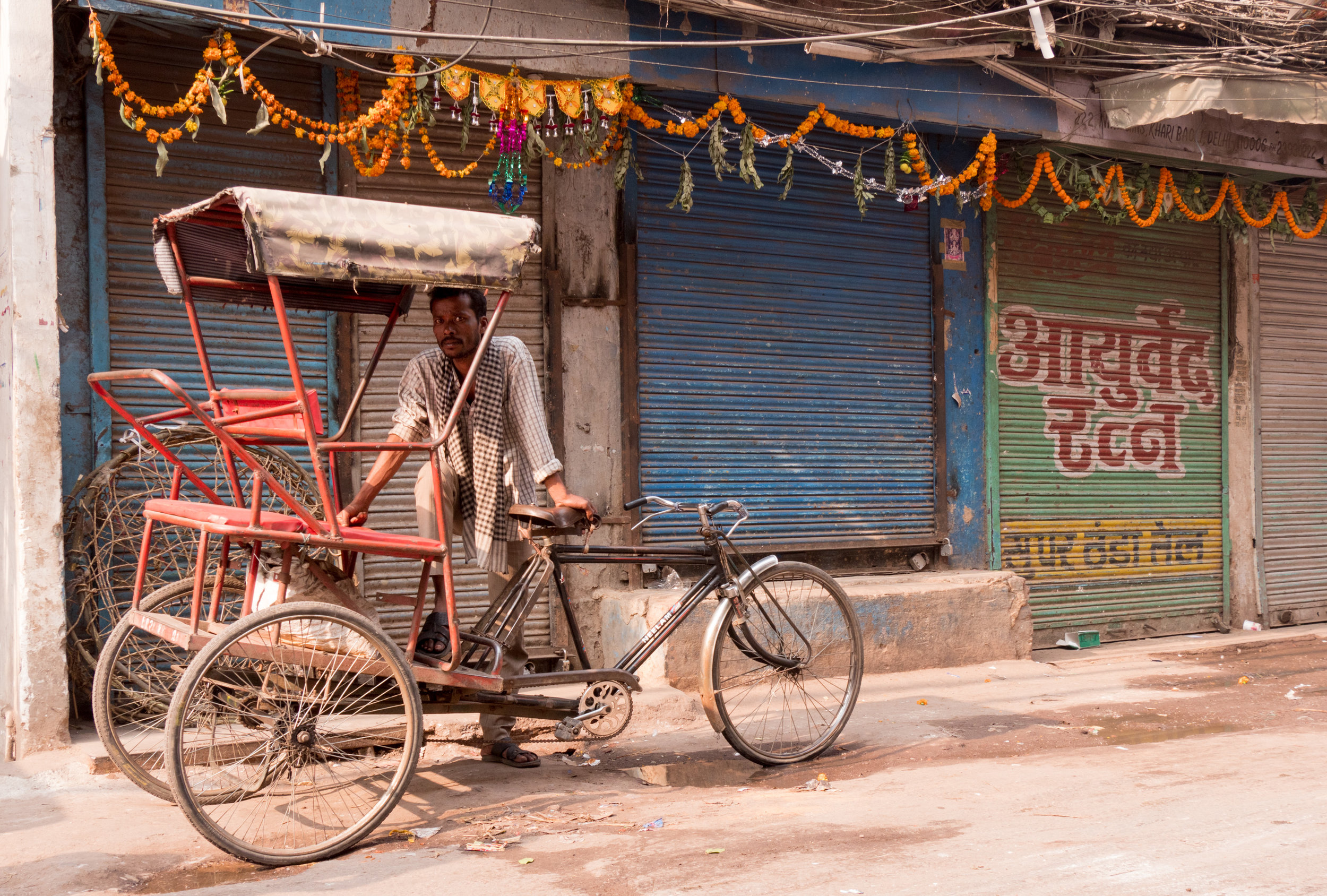 Man Standing with His Rickshaw at Spice Market - Old Delhi, India - Copyright 2016 Ralph Velasco.jpg