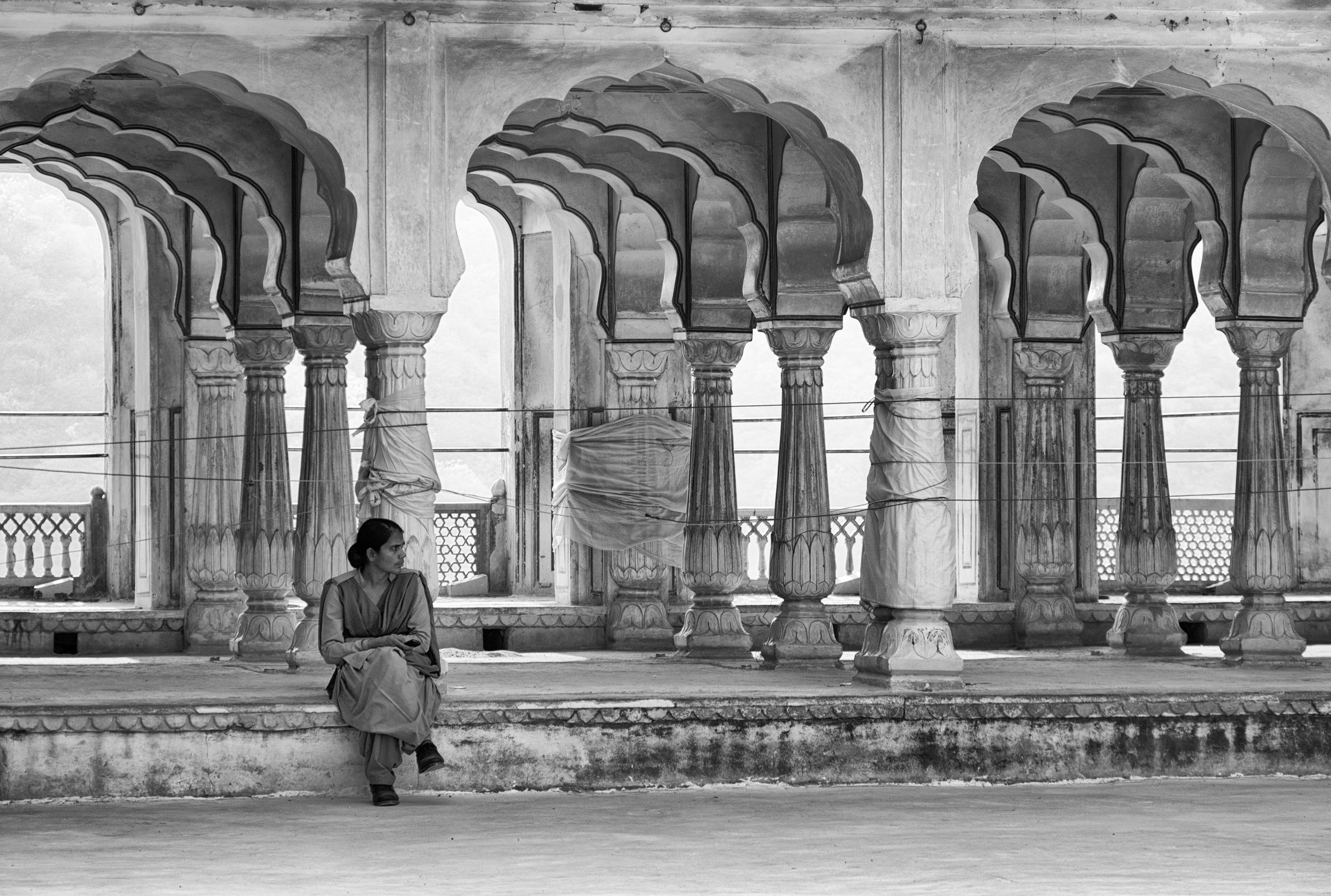 Woman Sitting by Scalloped Arches at Amber Fort - Jaipur, India - Copyright 2016 Ralph Velasco.jpg