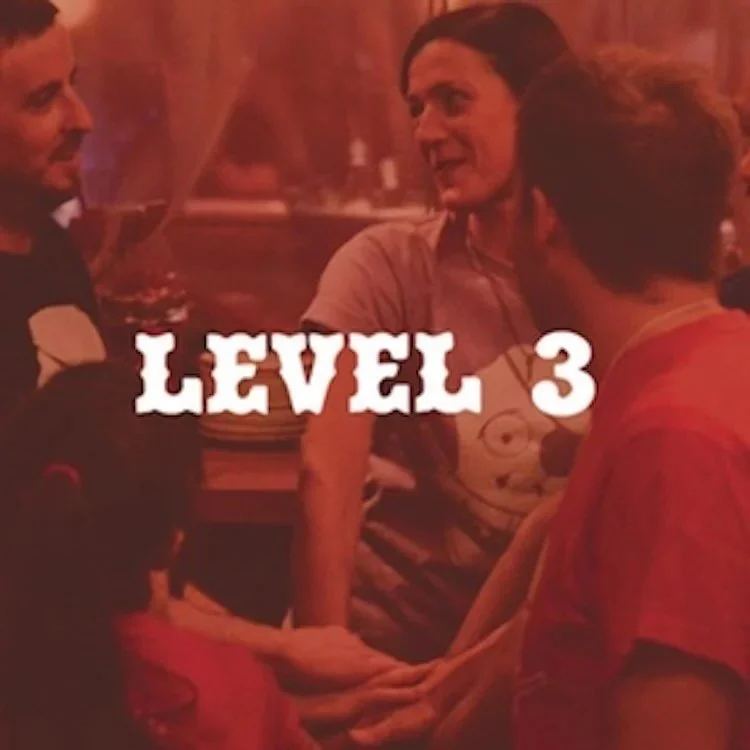 Advanced improv students putting hands together before their student show Level 3 即興コメディ 上級 生徒ショー 東京 Pirates of Tokyo Bay