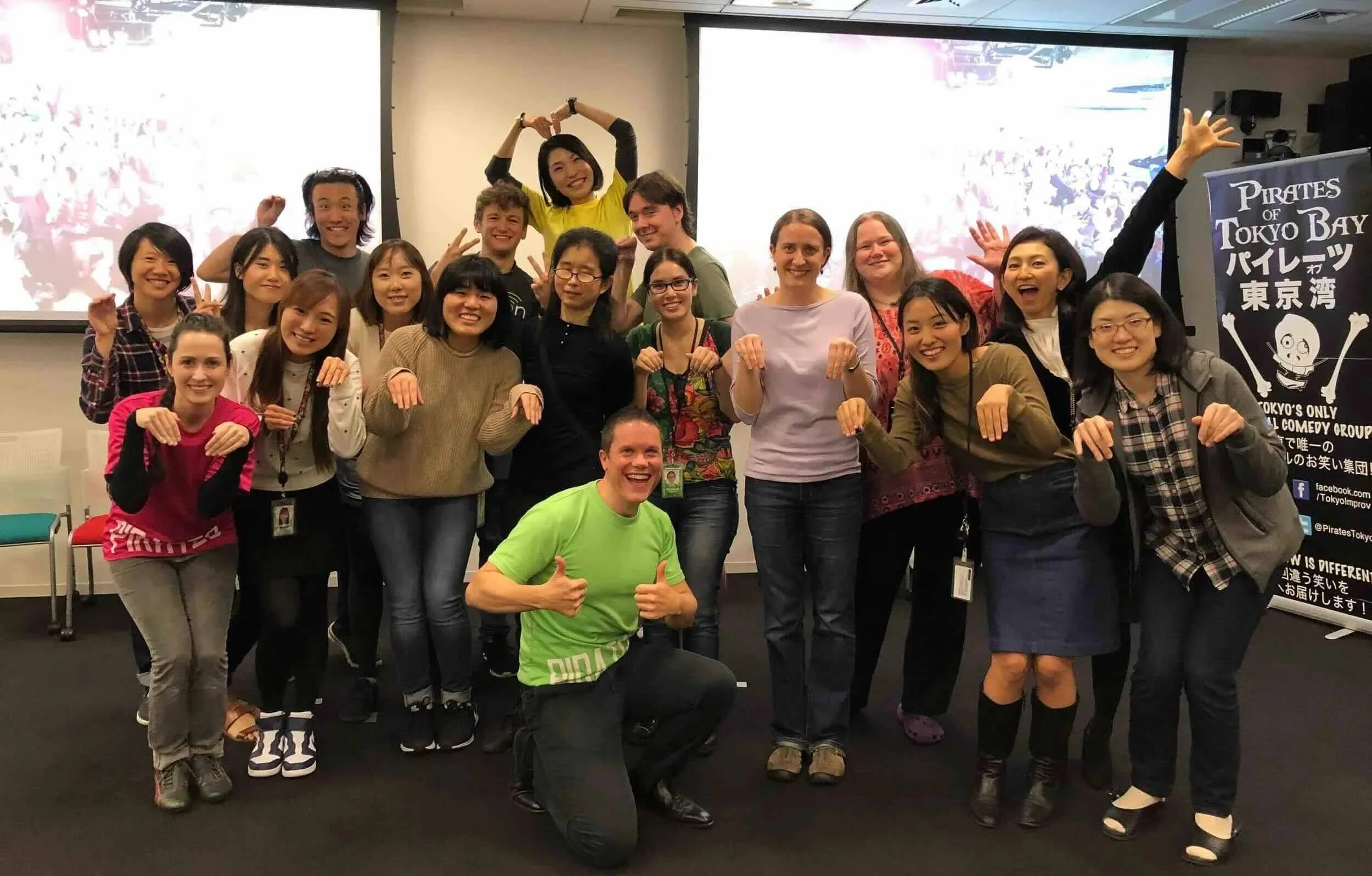 Beginners practicing a group scene during an English and Japanese improv class in Tokyo