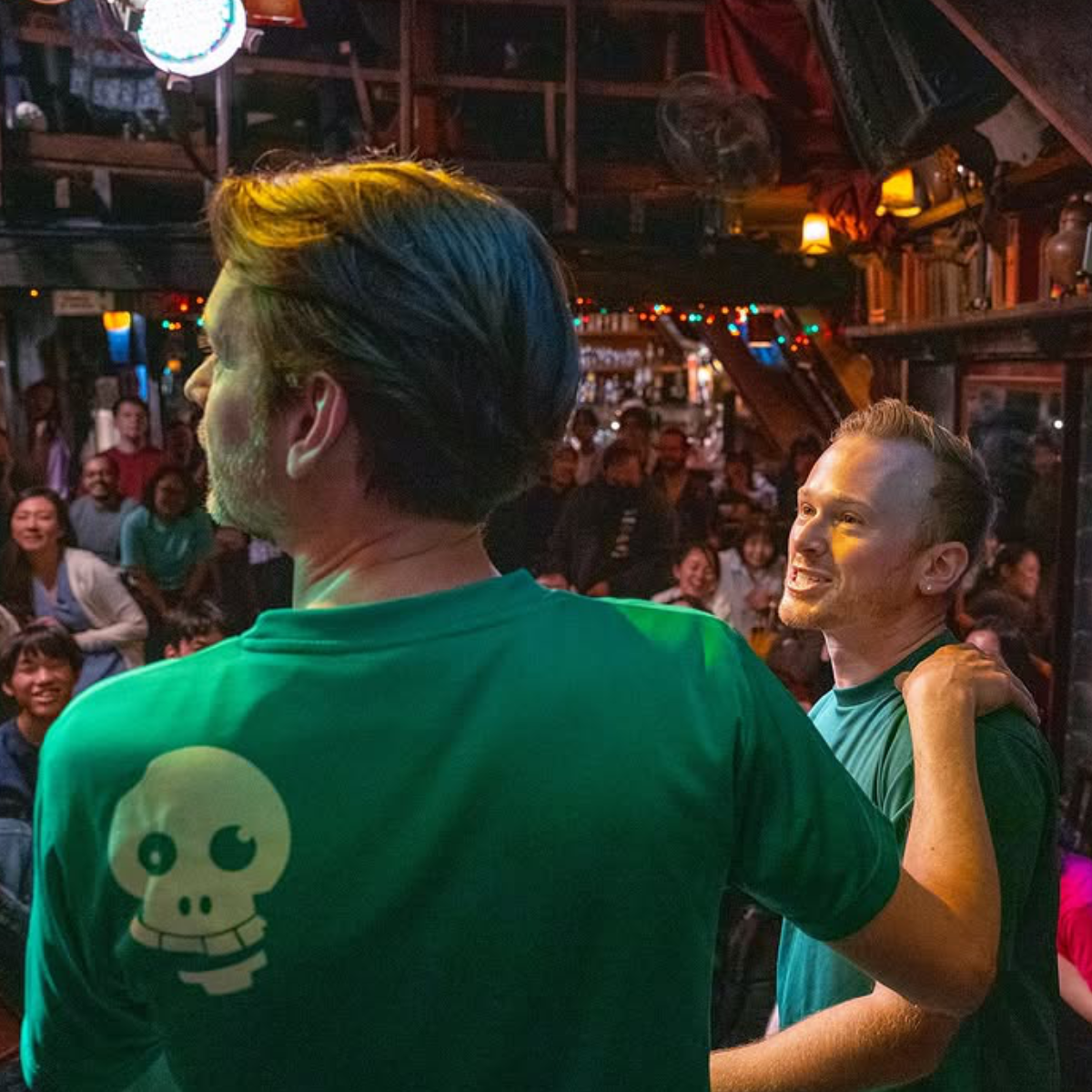 Two Pirate members on stage performing to a full audience in Tokyo Japan at What the Dickens! in Ebisu