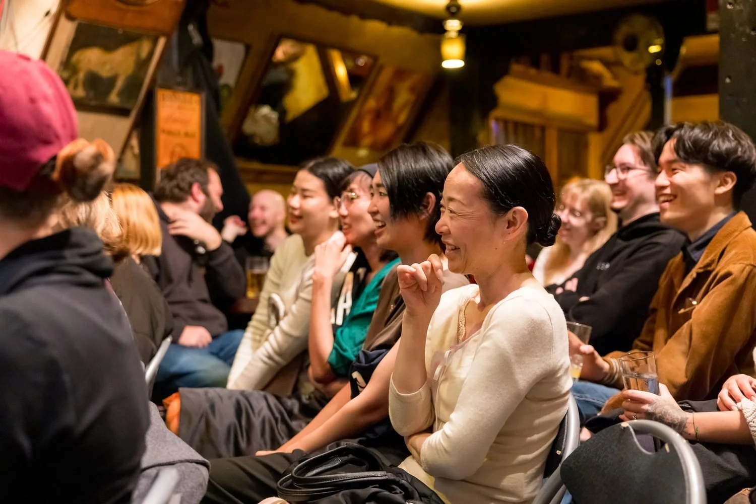 Japanese and international guests laughing together at an improv comedy show at What the Dickens! in Ebisu Tokyo | 日曜の夜 東京 恵比寿 | Pirates of Tokyo Bay