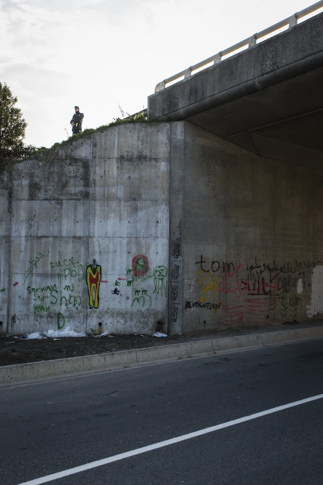 A CRS officer standing watch over the camp from a high vantage point