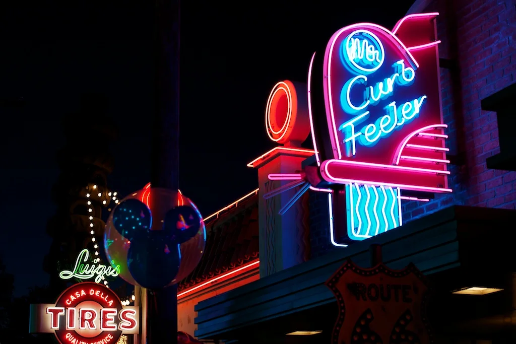 Disneyland_Cars_Land_Neon_Signs_Curb_Feeler_Luigi_Mickey_Balloon.jpg