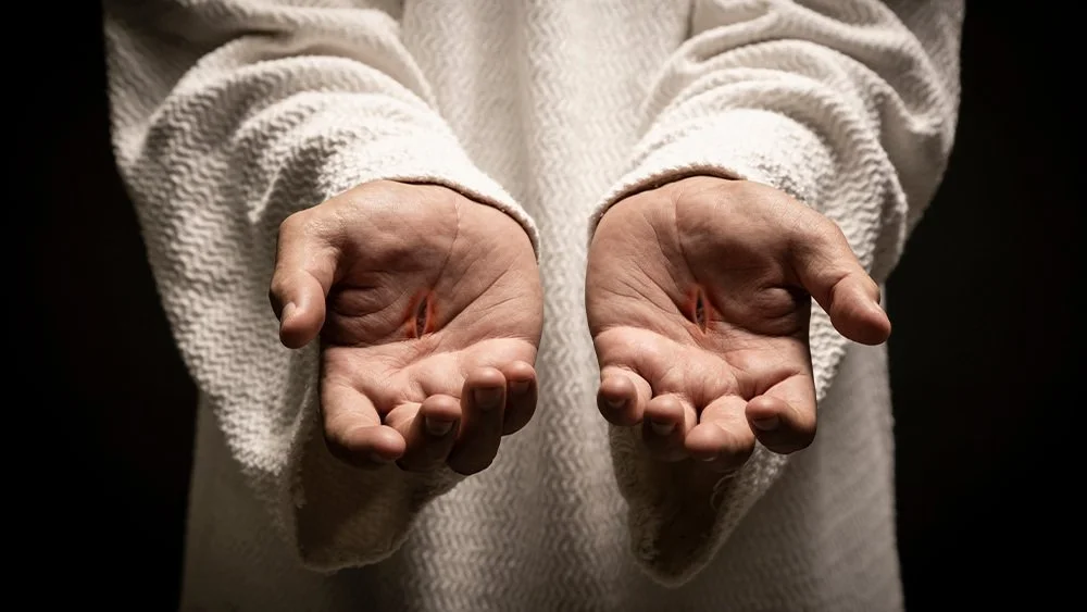 Las manos y los pies traspasados de Jesús