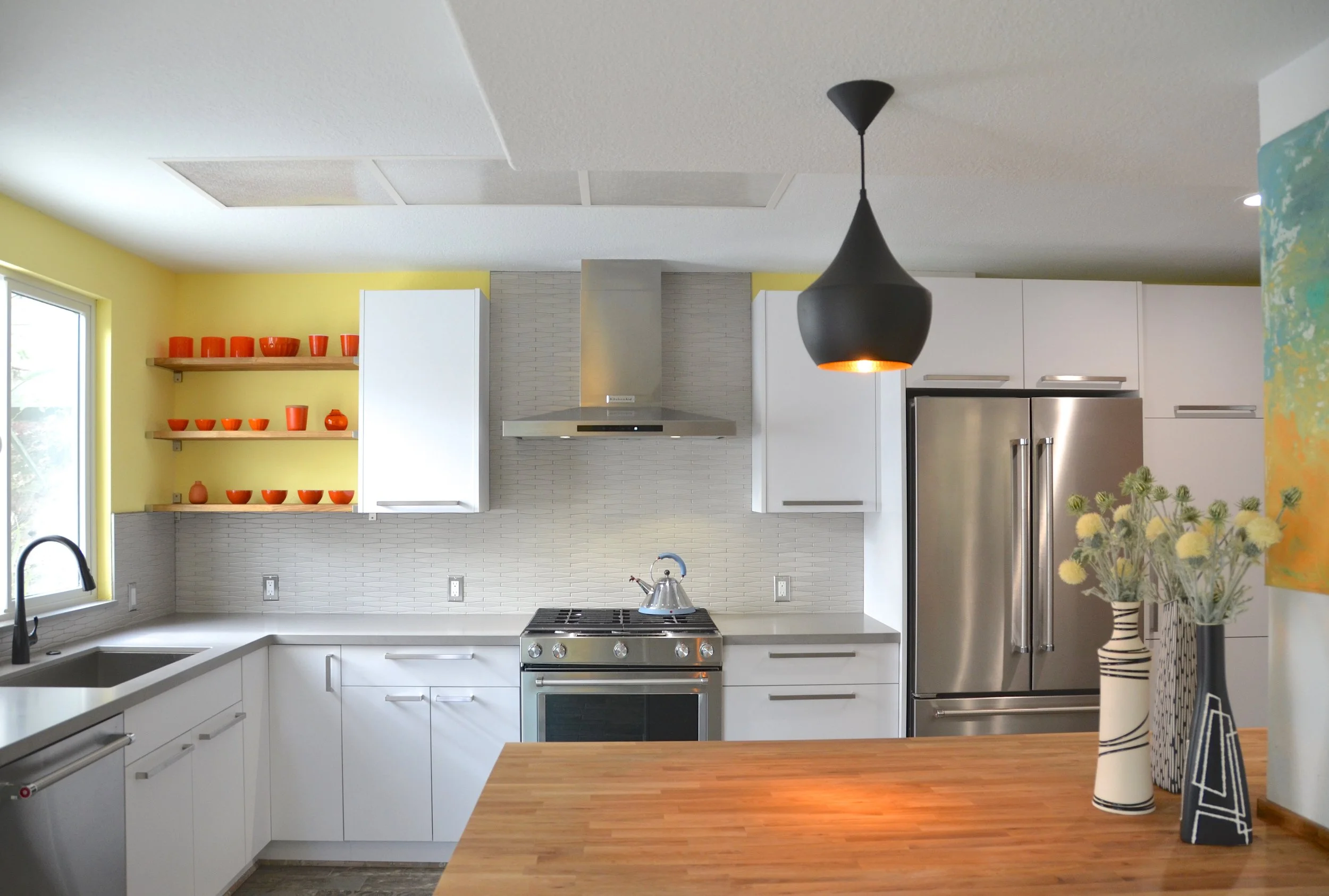     material + mix  With opening up the original cramped lay-out to the dining room, this Walnut Creek kitchen received a major make-over. The goal was both to give it an open airy feel and connect it to the rest of the house. Great attention was giv