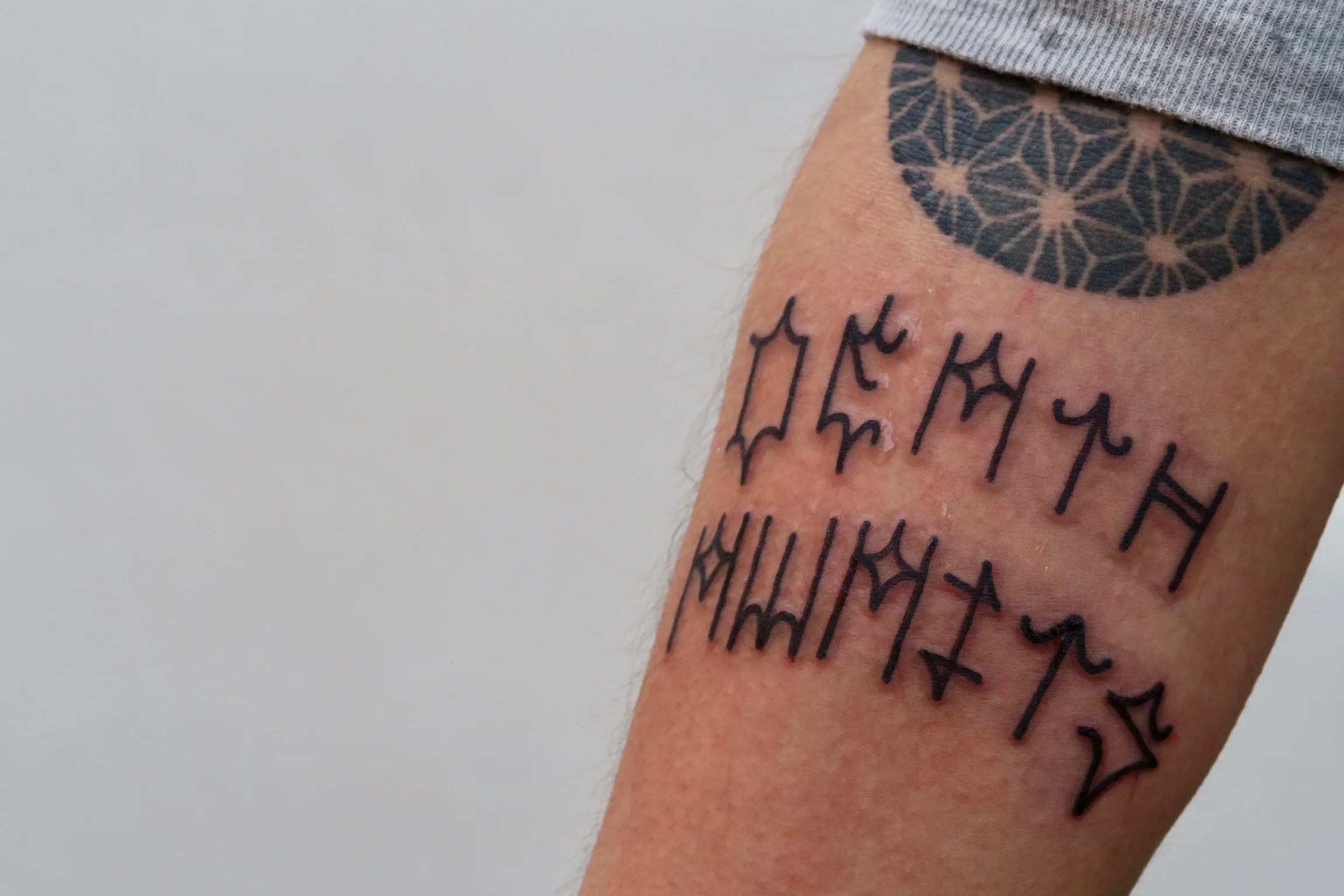 Dklein Permanent Markings permark black tattoo.jpg