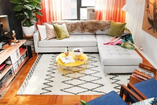 Refinery 29 knows how to pull off orange! I love how livable and (large?) this space looks. The height of the plant, the dreamy chaise for space saving seating- so pretty! 