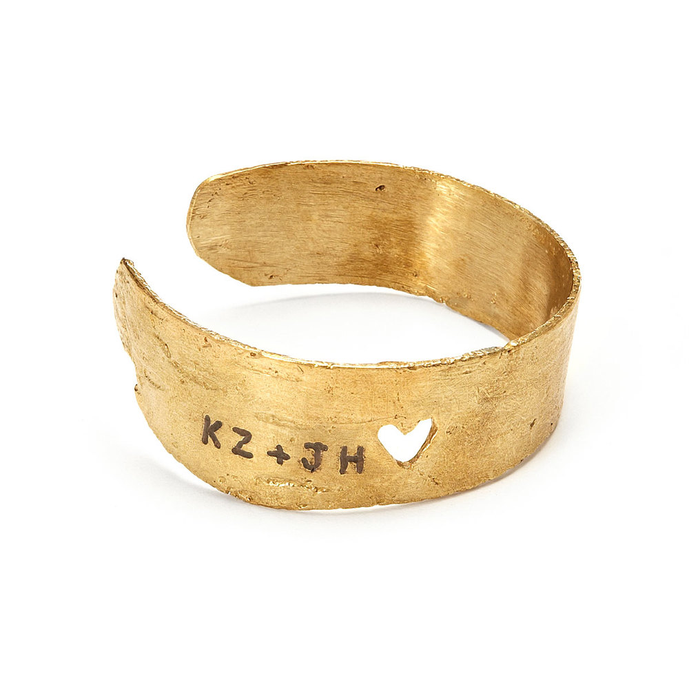  This bracelet is handmade from birch bark and custom engraved with the initials of you and your sweetie. If you can't carve into a tree, this might be the next best (better?) thing! Find it  Here  